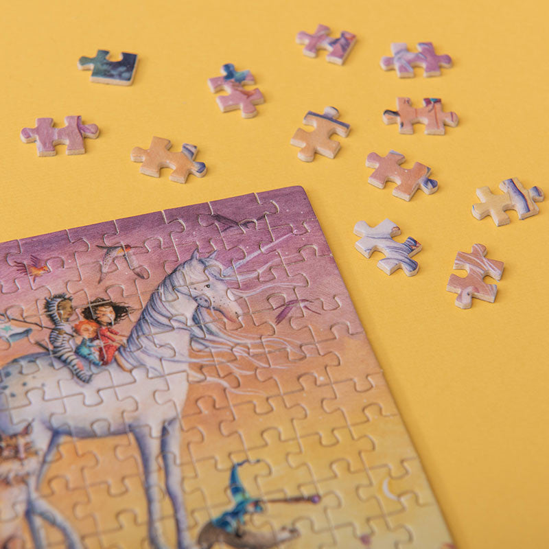 150-piece-micro-puzzle-my-unicorn Unfinished puzzle with a unicorn and rider illustration on a yellow background