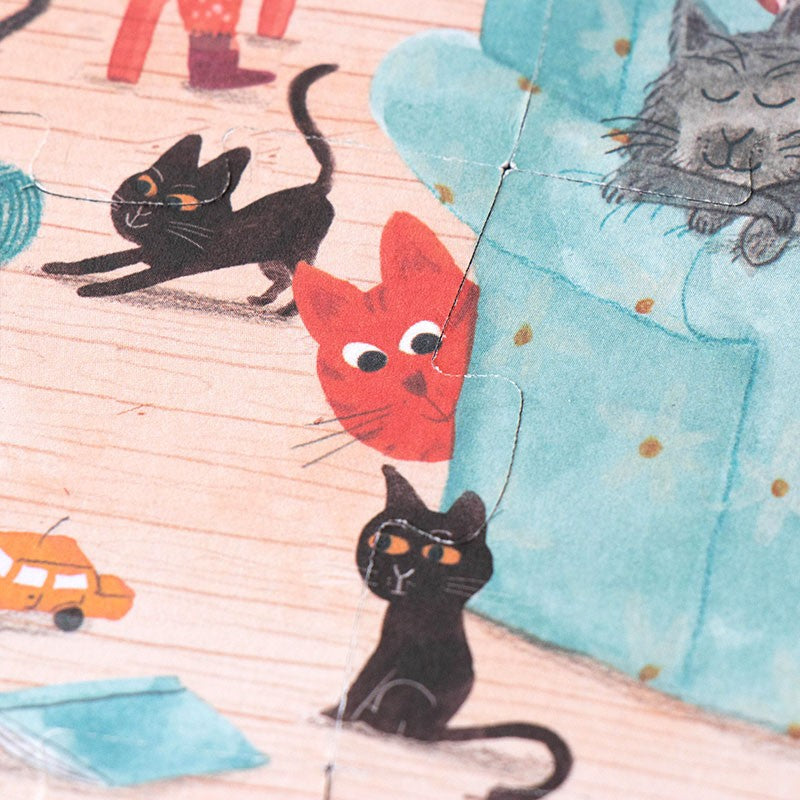 I24-piece-double-sided-pocket-puzzle-cats-and-dogs llustration of cats and a car on fabric with a wooden surface.