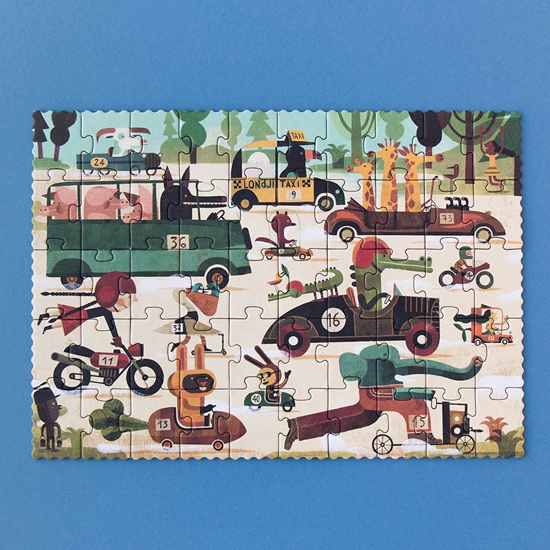 50-piece-pocket-puzzle-vroom-vroom with illustrated vehicles and animals on a blue background