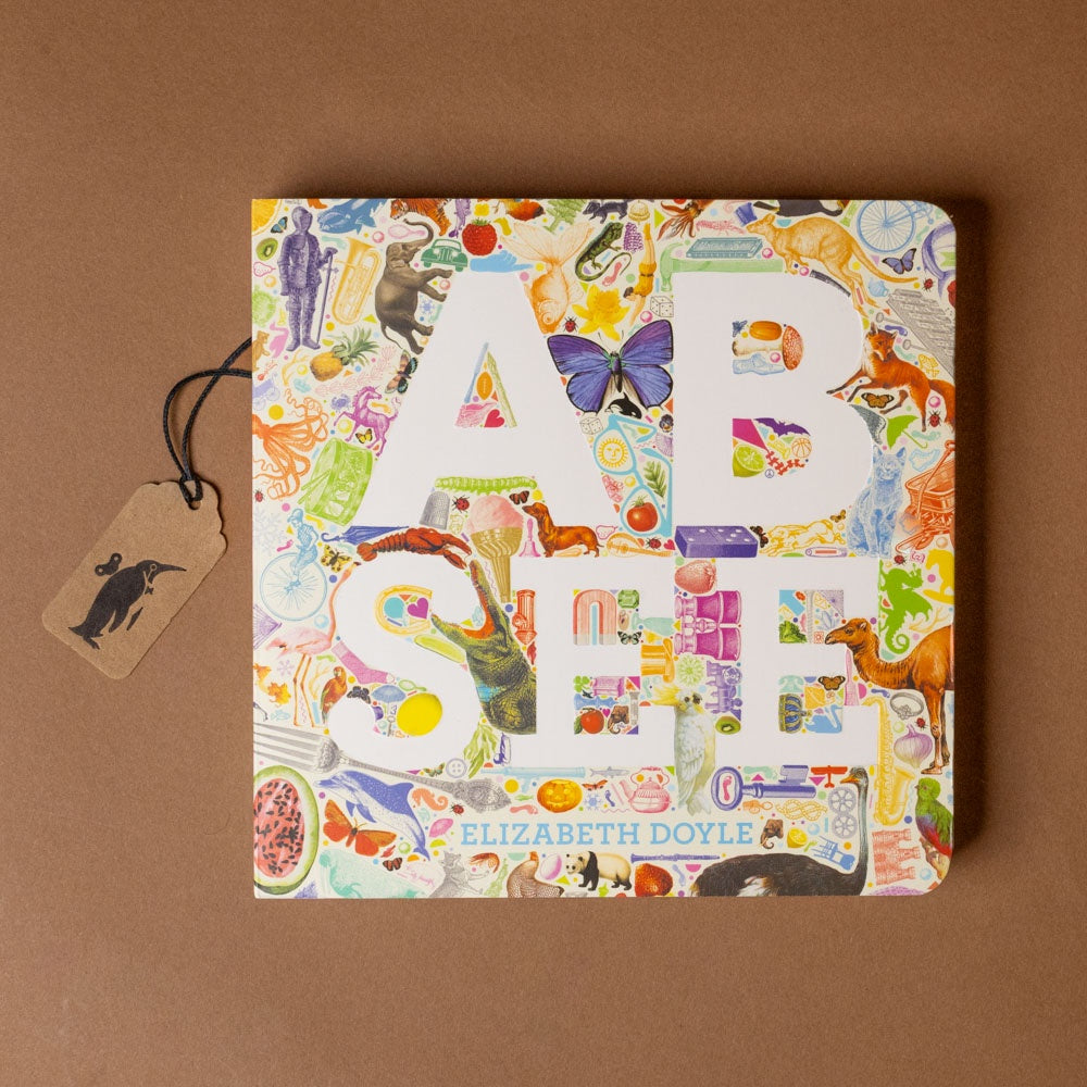 Children's book titled 'a-b-see' with colorful illustrations on a brown background