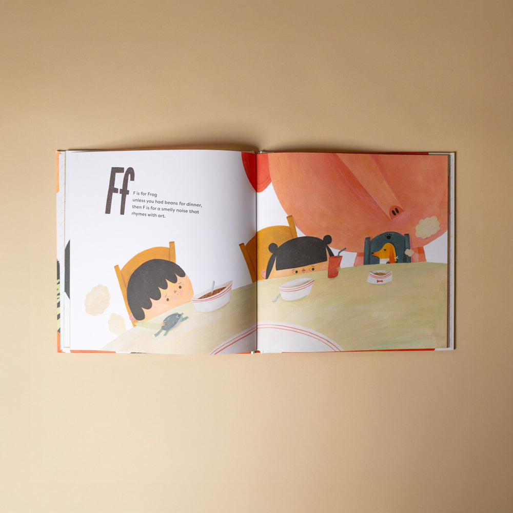 a-is-for-apple-unless Open book with illustrations on a beige background