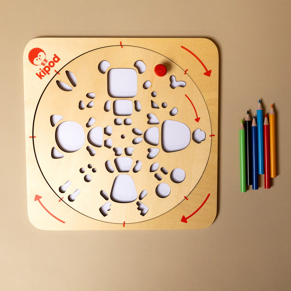 wooden artwist-art-kit-animals and colored pencils on a beige background