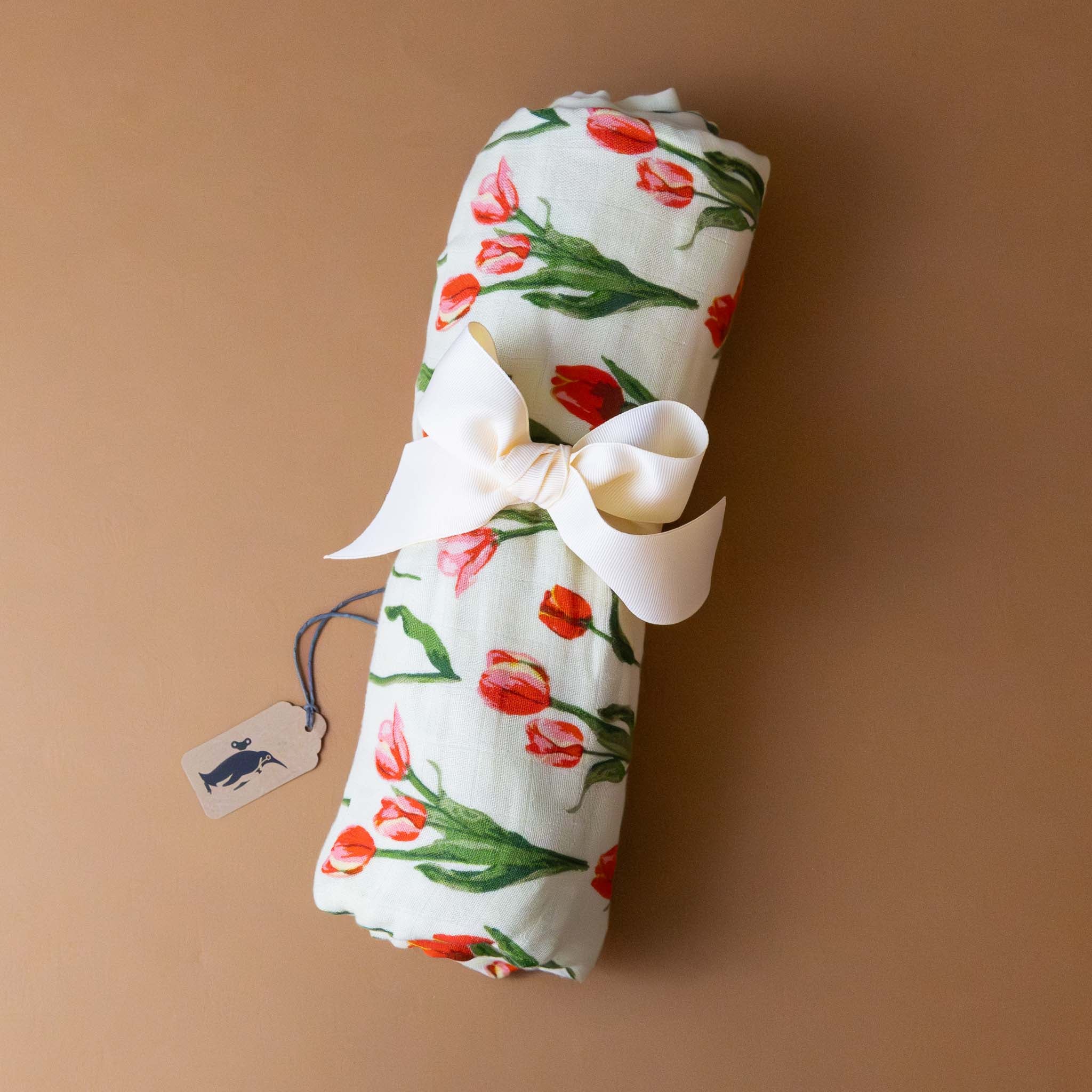 bamboo-swaddle-tulip-red-and-green-print-on-white-with-a-bow