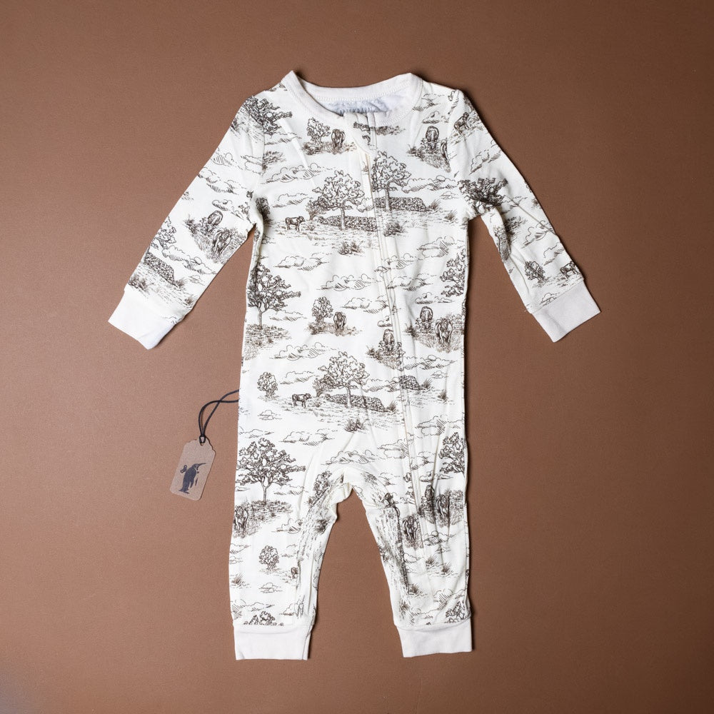 bamboo-zipper-pajamas-meadow-toile Baby onesie with nature print on a brown background