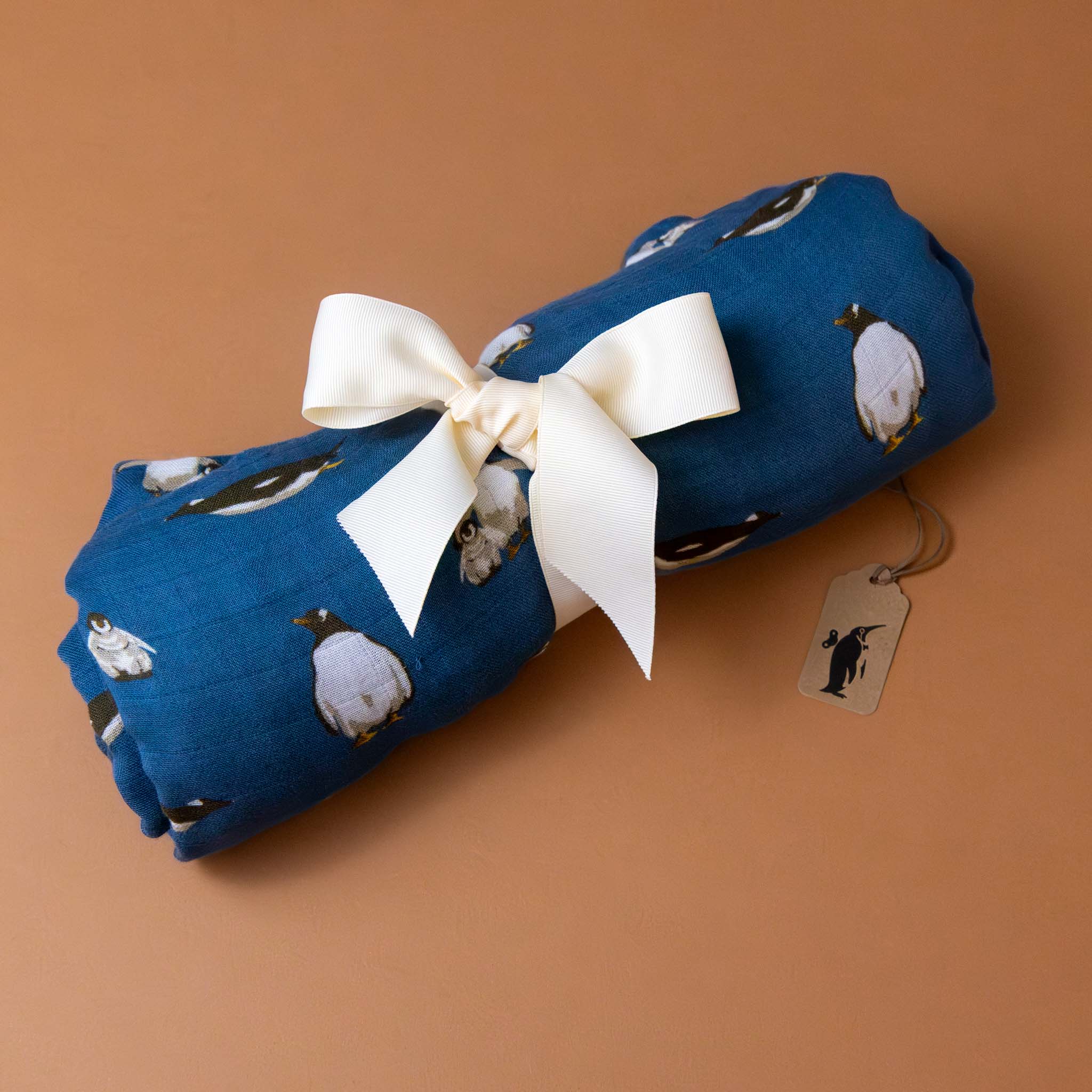 big-lovie-penguins-on-blue-background-print-rolled-with-ribbon