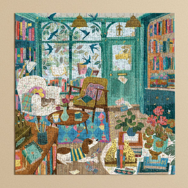 Colorful bookshop-afternoon-500-piece-puzzle of a cozy room with books, chairs, and decorative elements.