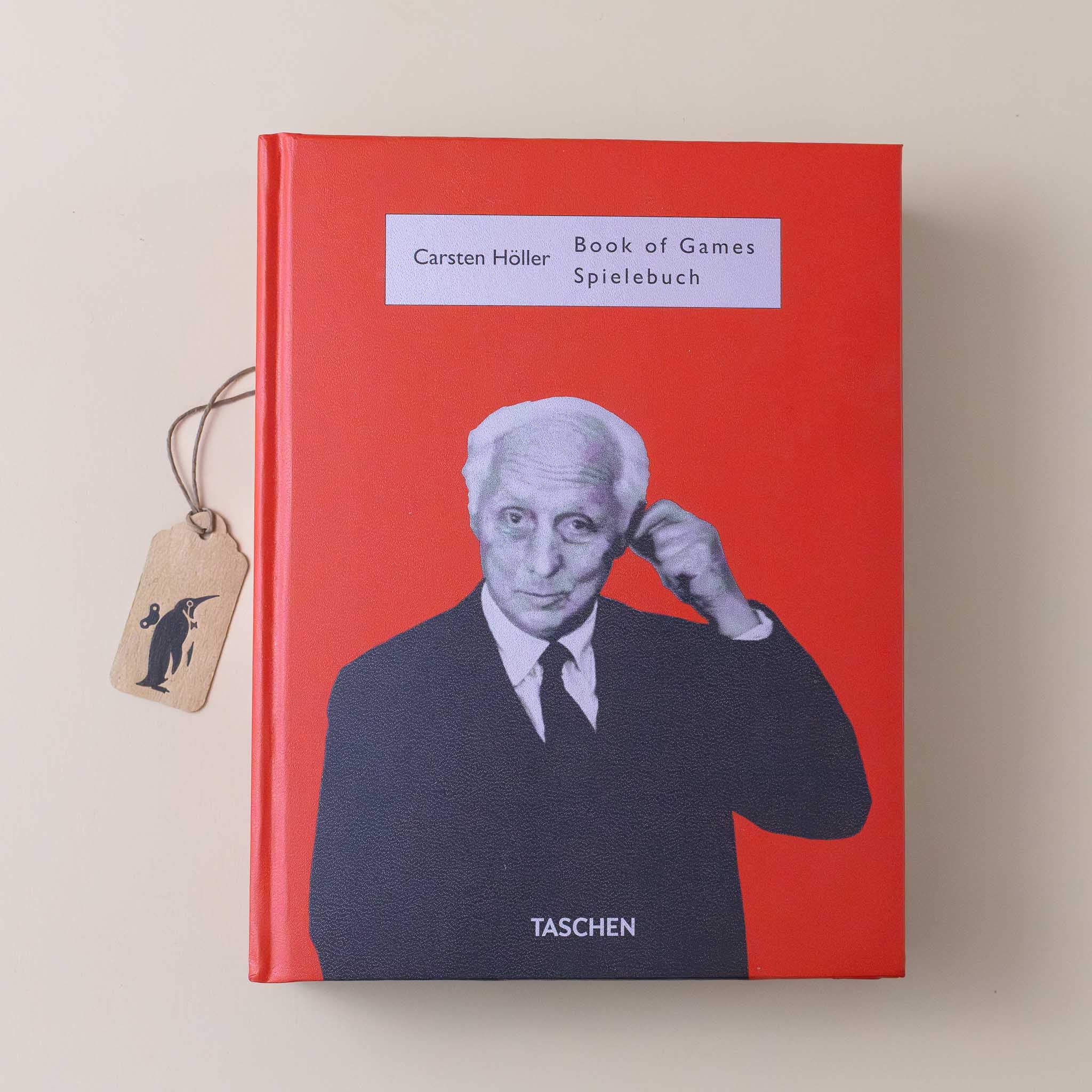 carsten-holler-book-of-games-red-cover-with-hollers-picture-in-black-and-white