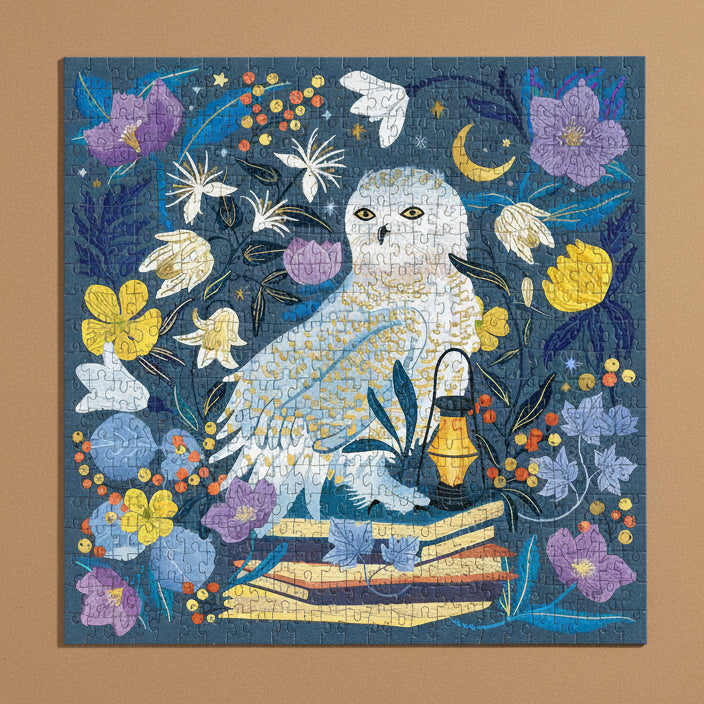 celestial-owl-500-piece-puzzle with an owl and floral design on a blue background