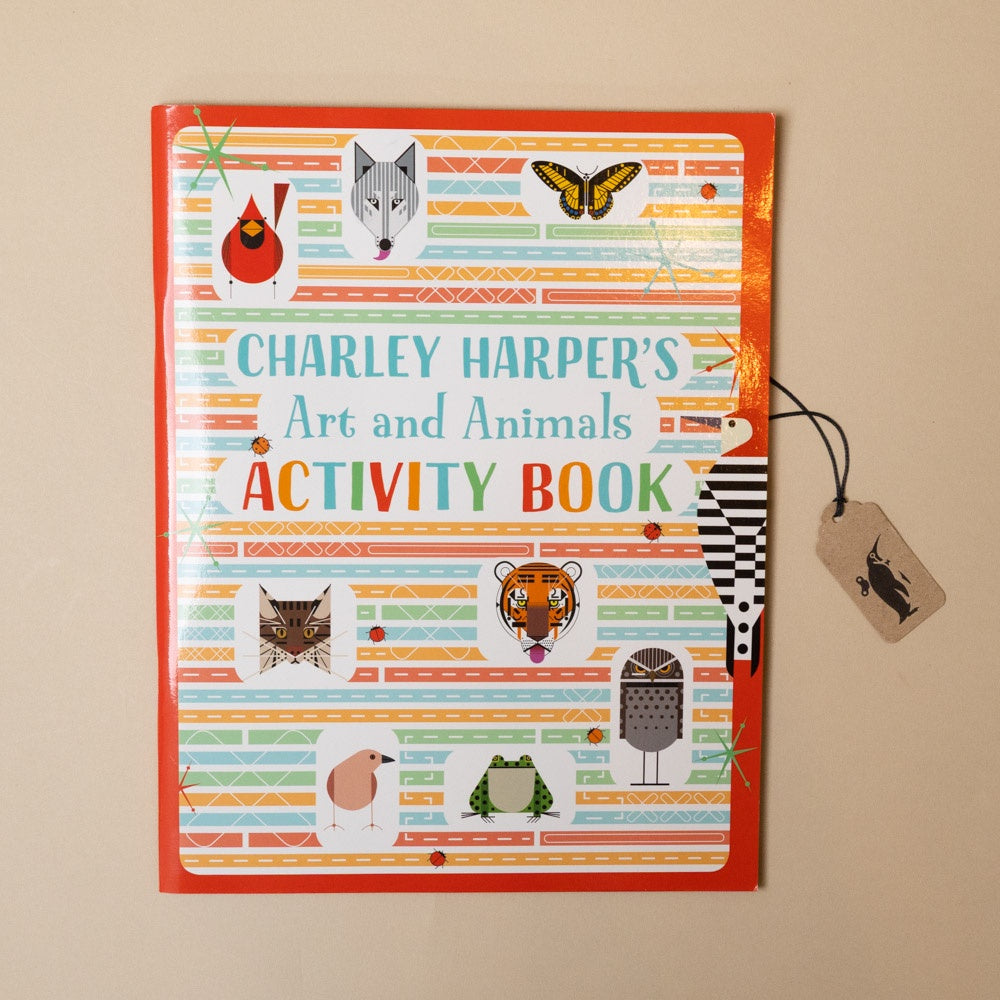 Activity book titled 'Charley Harper's Art and Animals Activity Book' with colorful design on a beige background