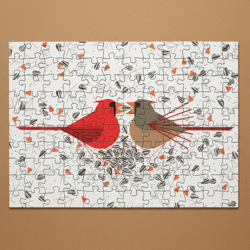 Jigsaw puzzle with a red and brown abstract design on a white background