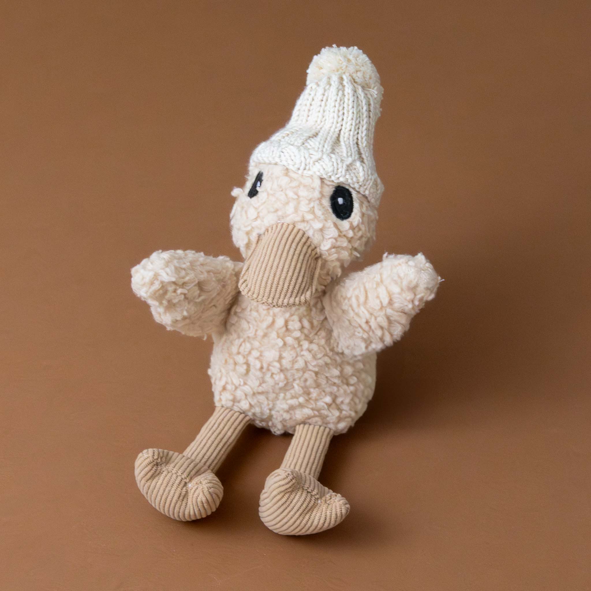 edmund-the-duckling-stuffed-animal-with-knit-beanie-and-corduroy-accents-sitting
