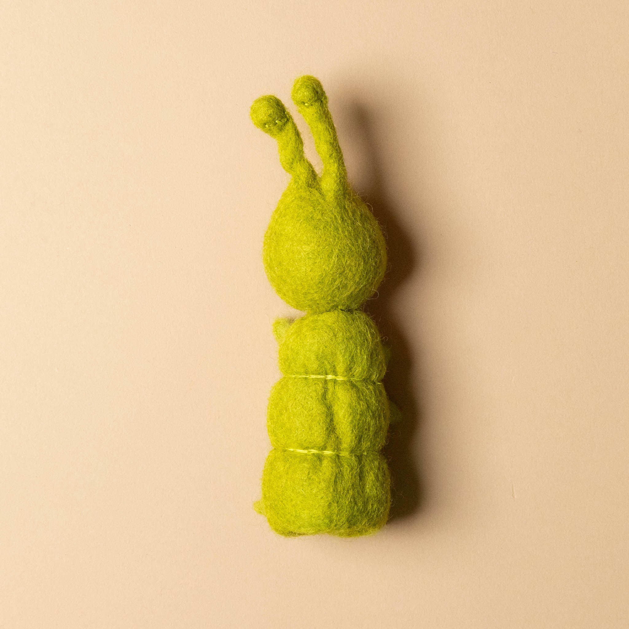 felted-green-caterpillar-finger-puppet-back