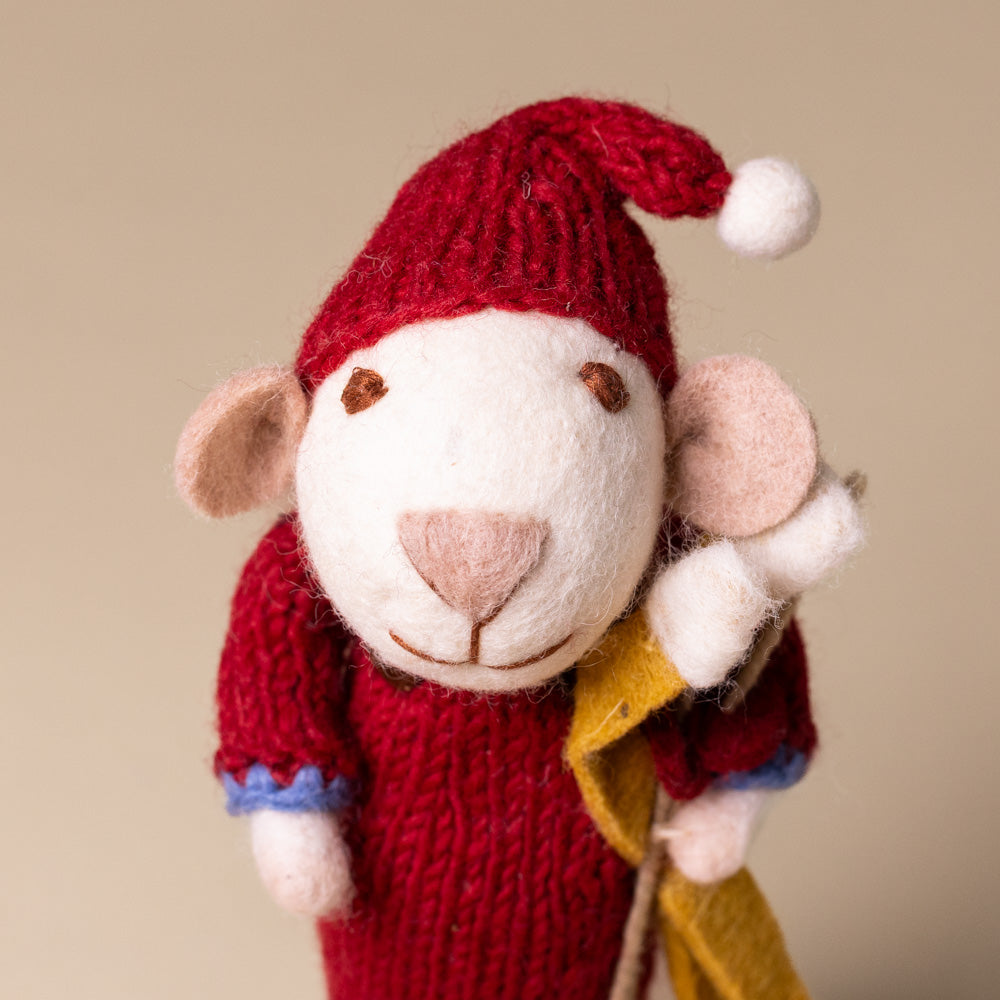 felted-white-mouse-red-dress-and-skis-face