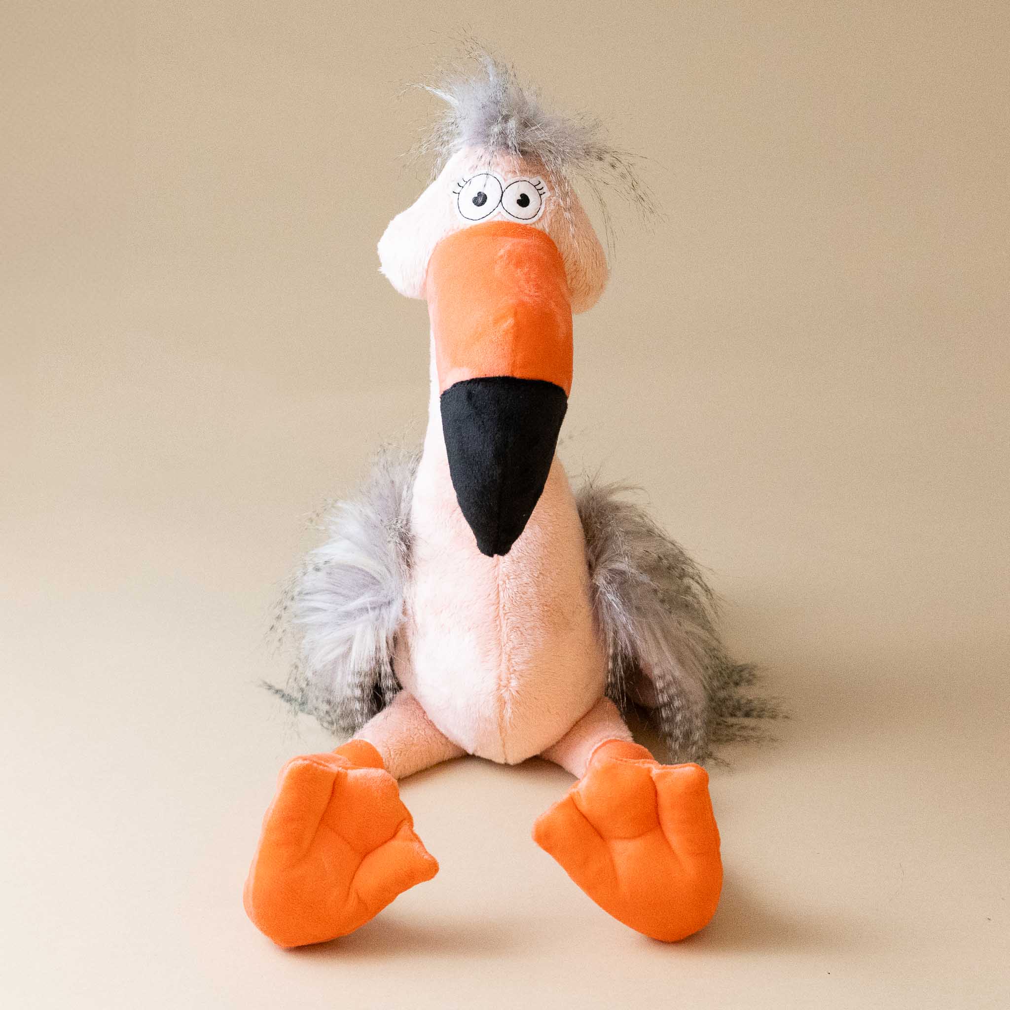 fool-flamingo-with-salmon-body-orange-beak-and-legs-and-grey-tufts-front