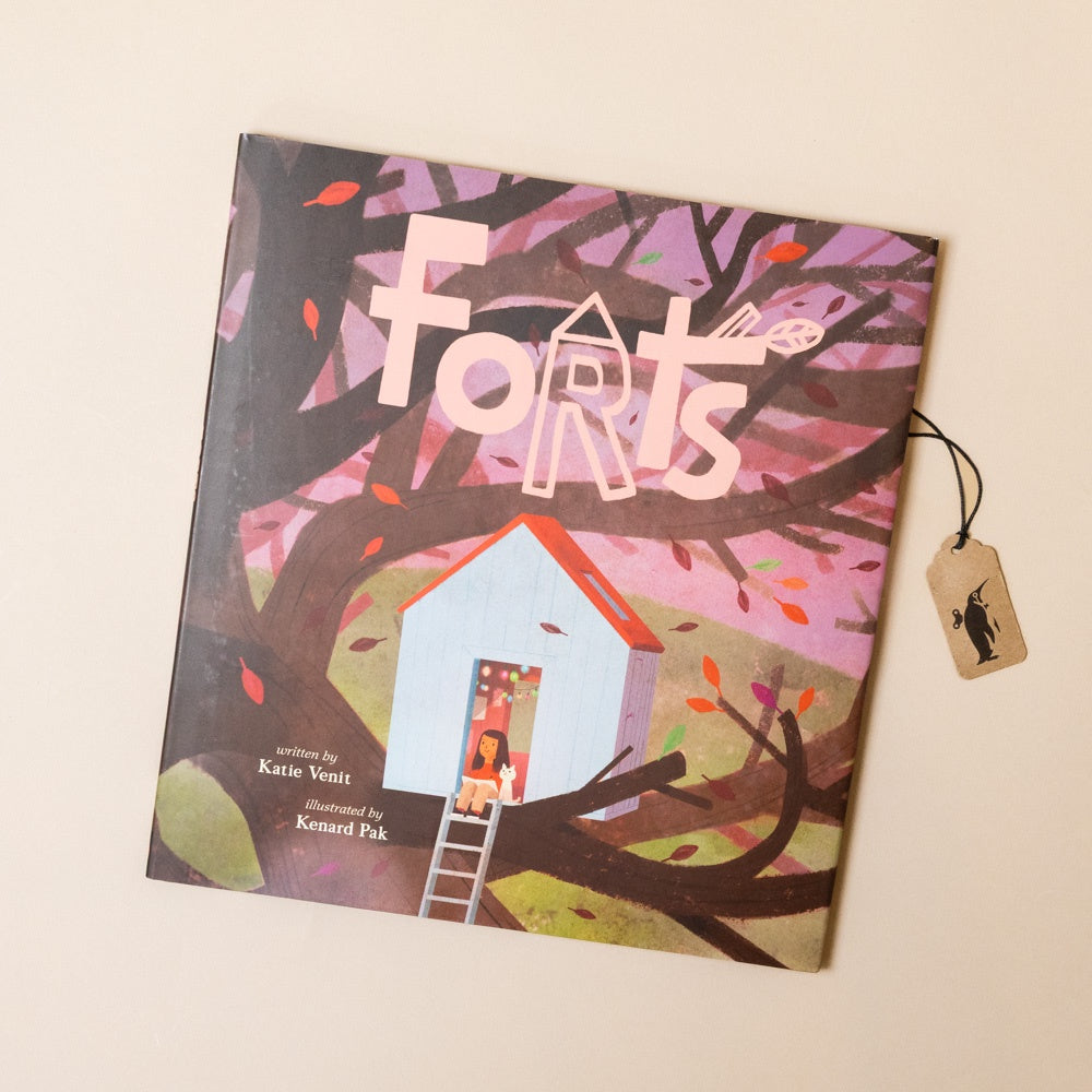 Book titled 'Forts' with a treehouse illustration on a beige background