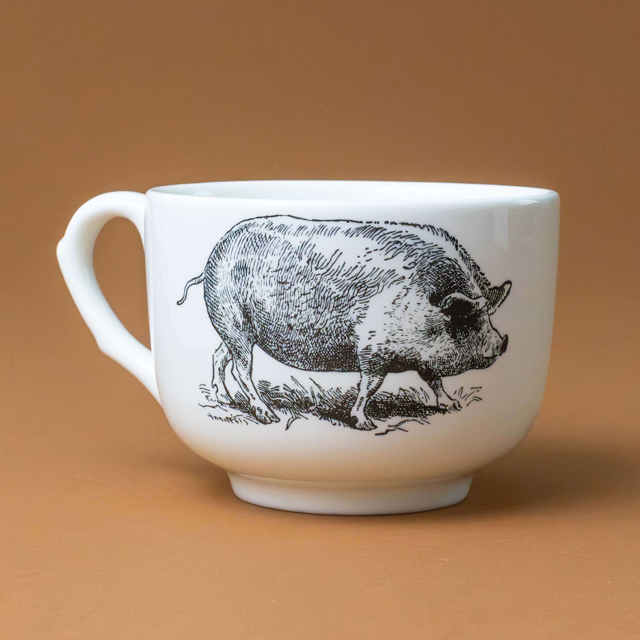 white-grande-stoneware-cup-black-illustration-pig-with-the-word-pig-in-pink-in-several-different-languages-on-interior-of-cup