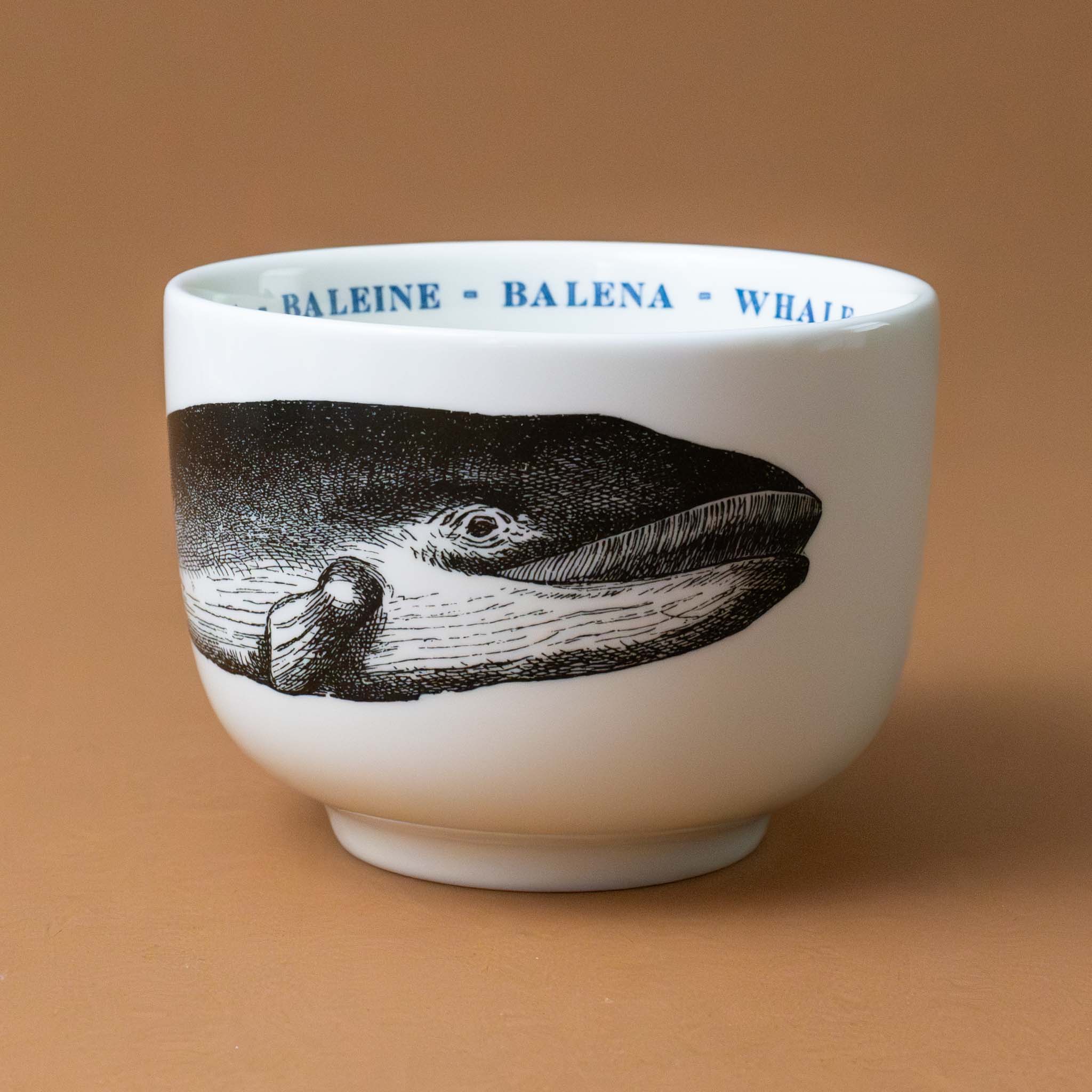 white-grande-stoneware-cup-black-illustration-whale-with-the-word-whale-in-blue-in-several-languages-on-interior-of-cup