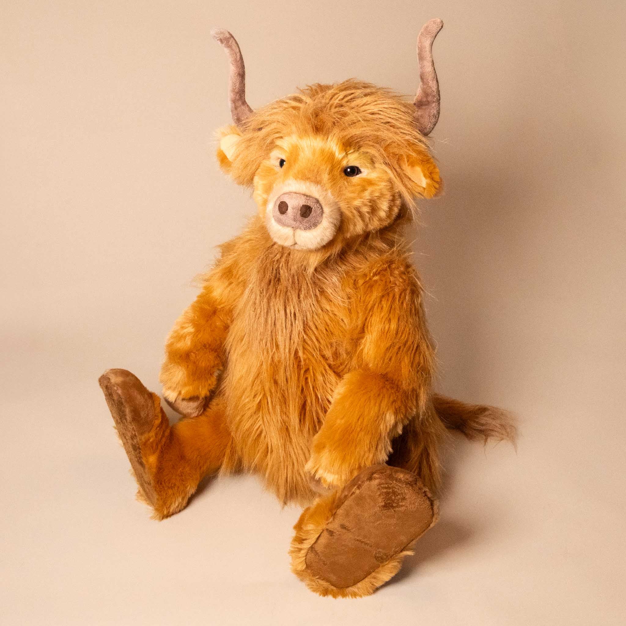 harry-hoofprints-the-highland-cow-stuffed-animal-sitting