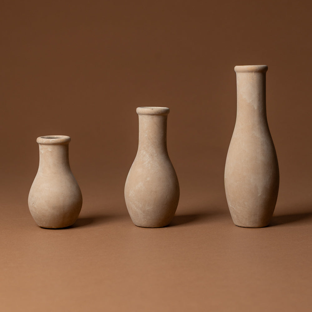 holden-bud-vase-small Three terracotta vases of varying sizes on a brown background