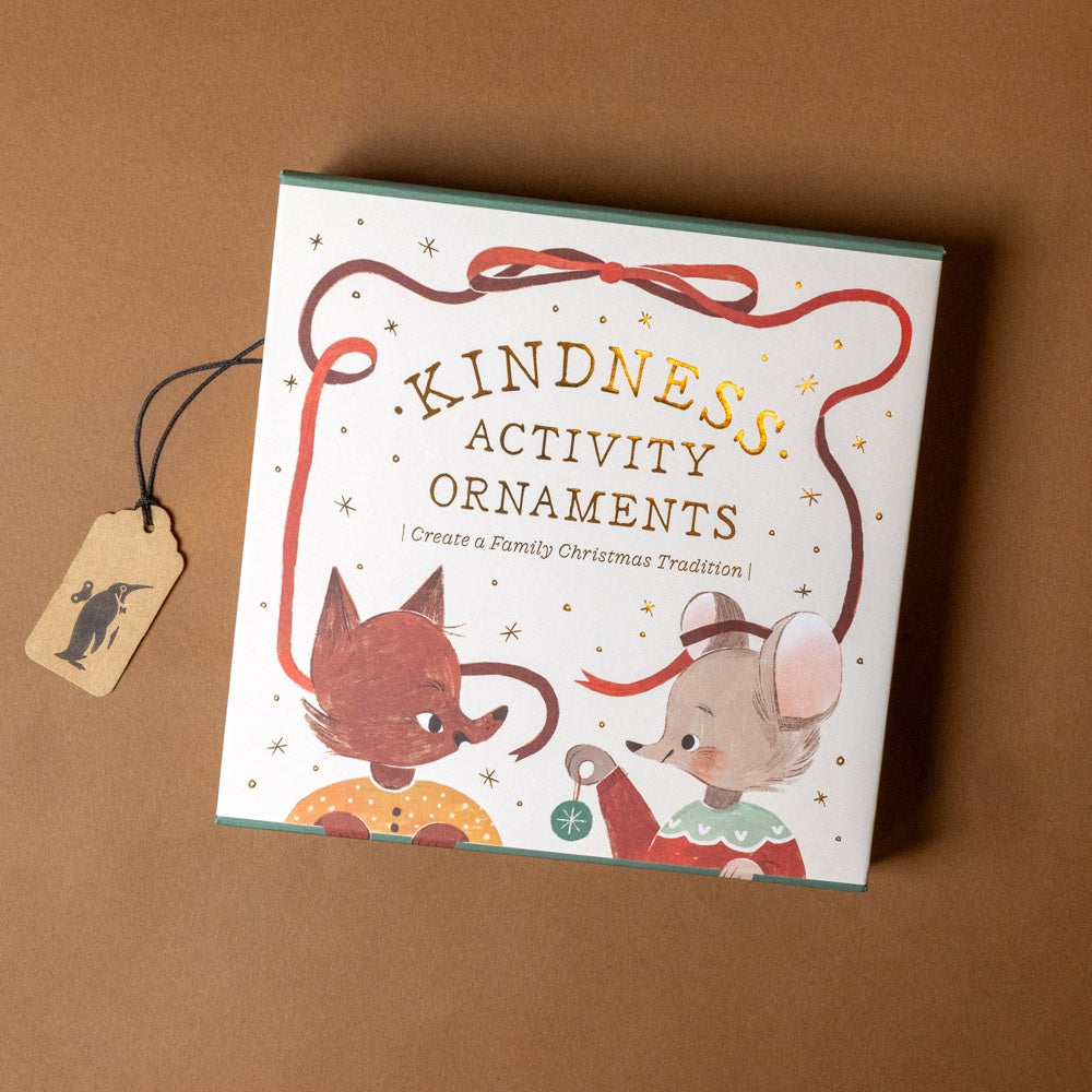 Box of 'Kindness Activity Ornaments' with illustrations of a fox and a mouse on a brown background.