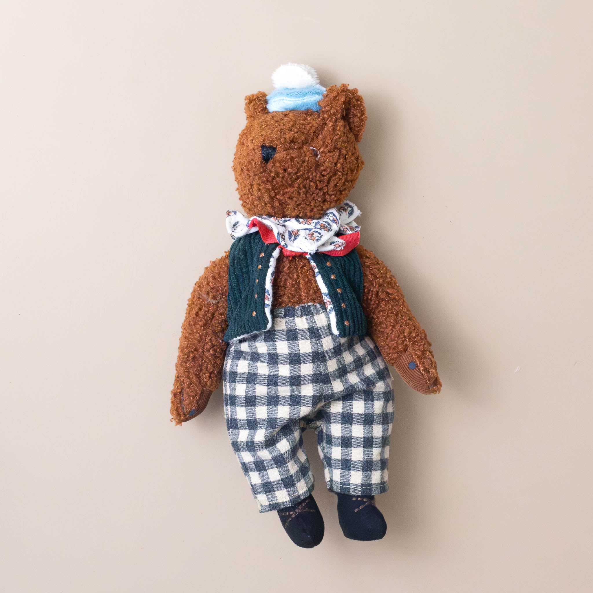 les-minouchkas-baba-the-bear-stuffed-animal-wearing-a-hat-vest-scarf-and-checked-pants