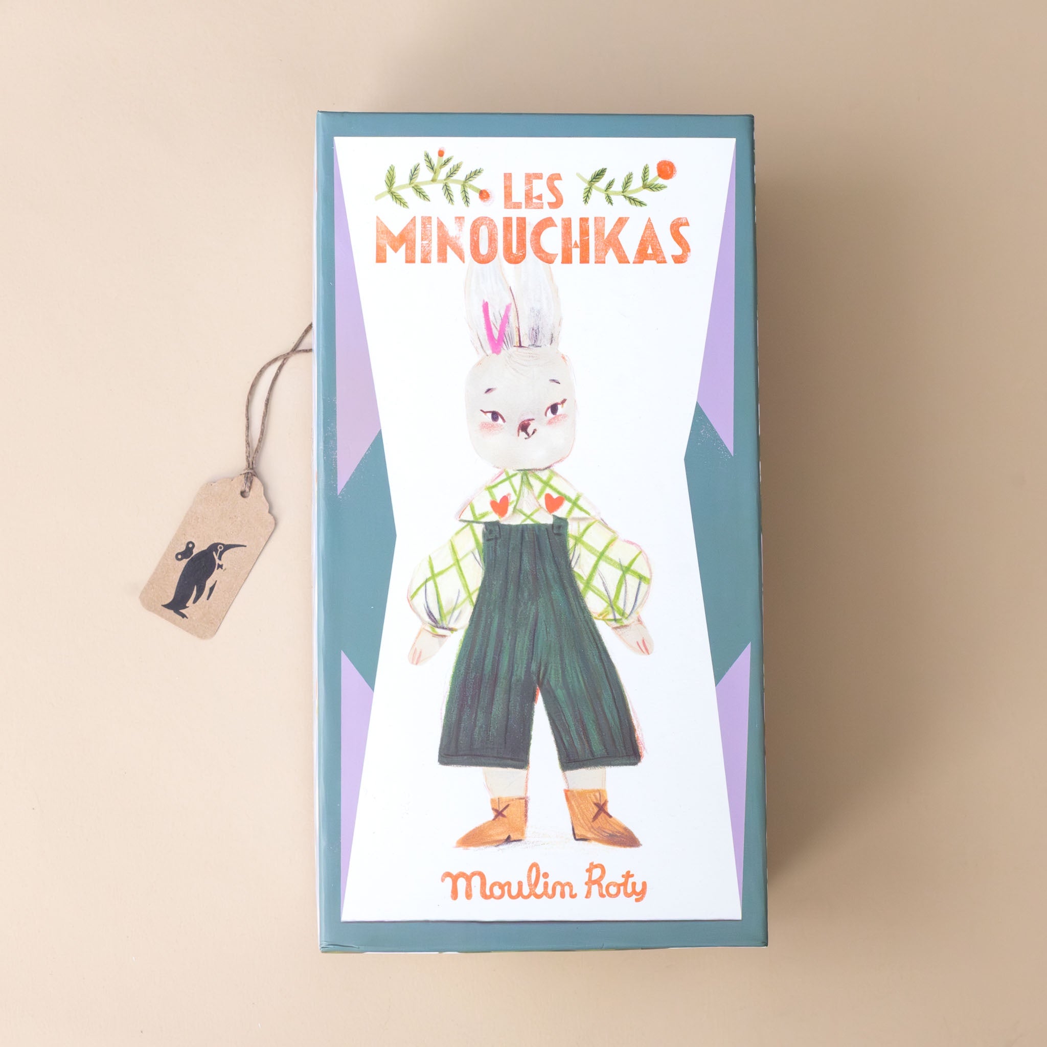 les-minouchkas-nine-the-rabbit-dressed-in-green-overalls-windowpane-checked-shirt-with-hearts-embroidered-on-collar-and-brown-satchel-box