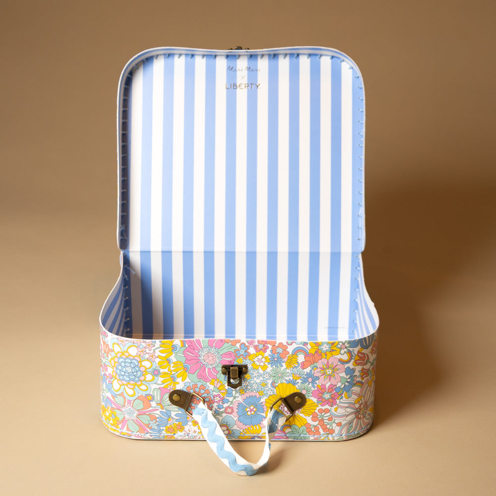 liberty-suitcase-large Floral-patterned suitcase with striped interior on a beige background