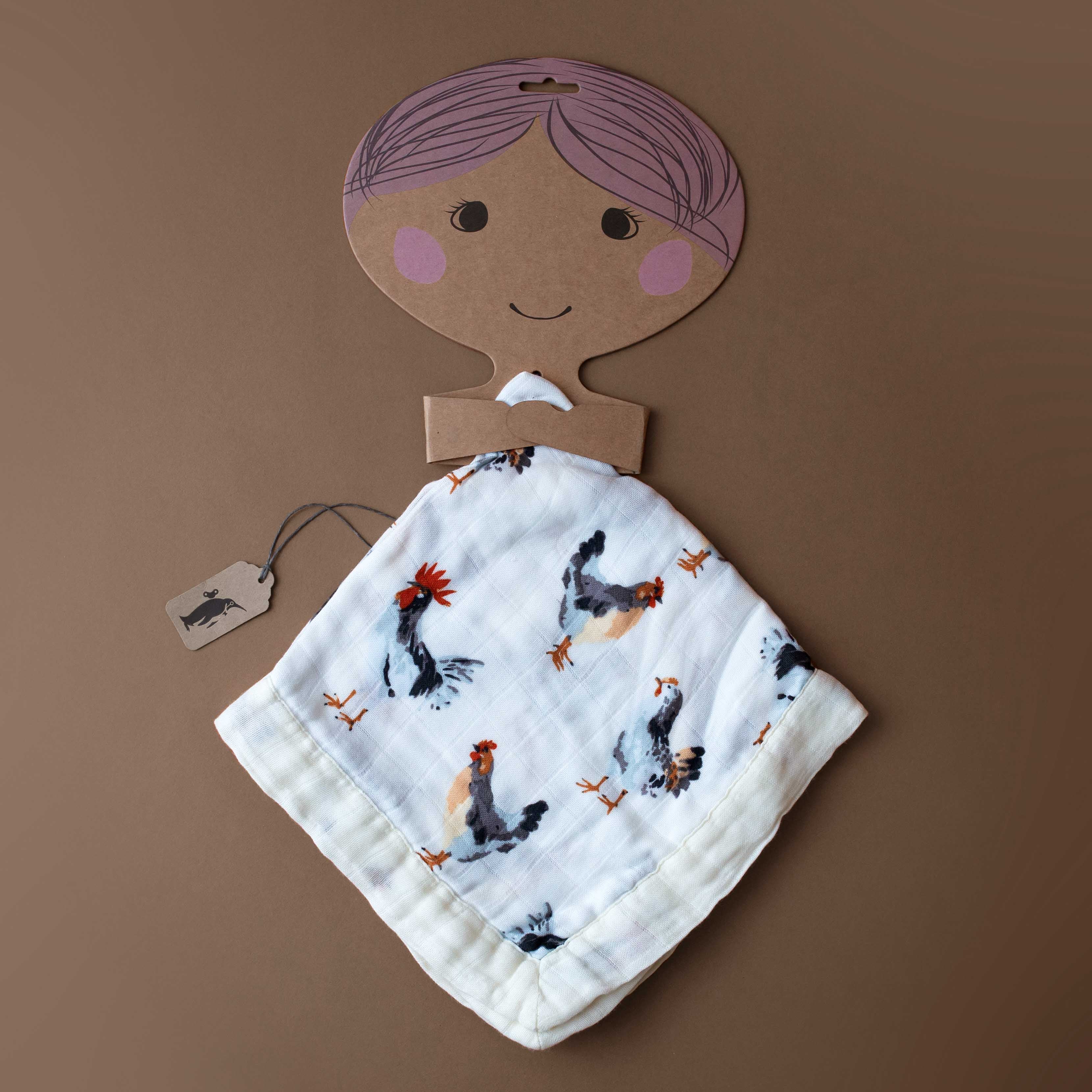 little-lovie-chickens Baby blanket with chicken pattern on a brown cardboard cutout of a baby against a brown background