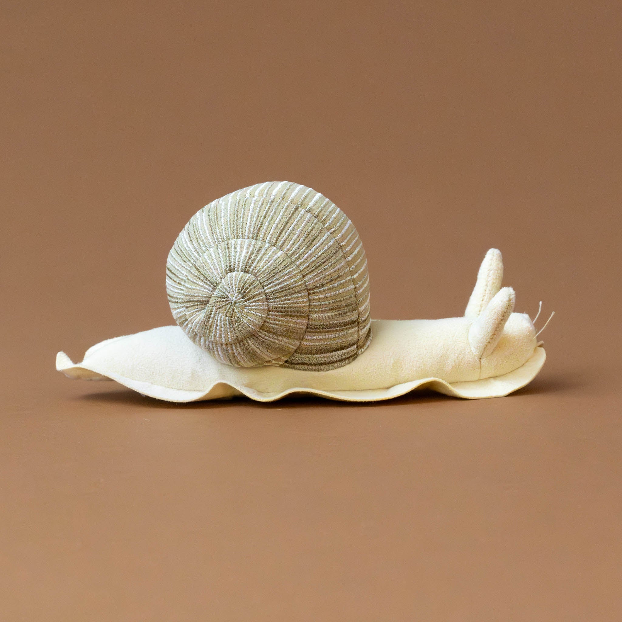 little-snail-stuffed-animal-cream-and-beige-side