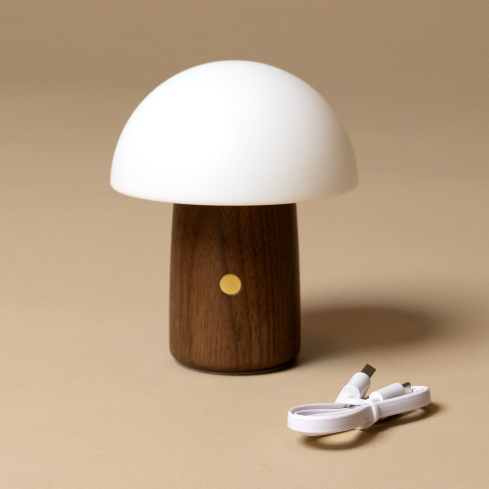 little-wooden-mushroom-lamp-walnutwith wooden base and white silicone cover on a beige background