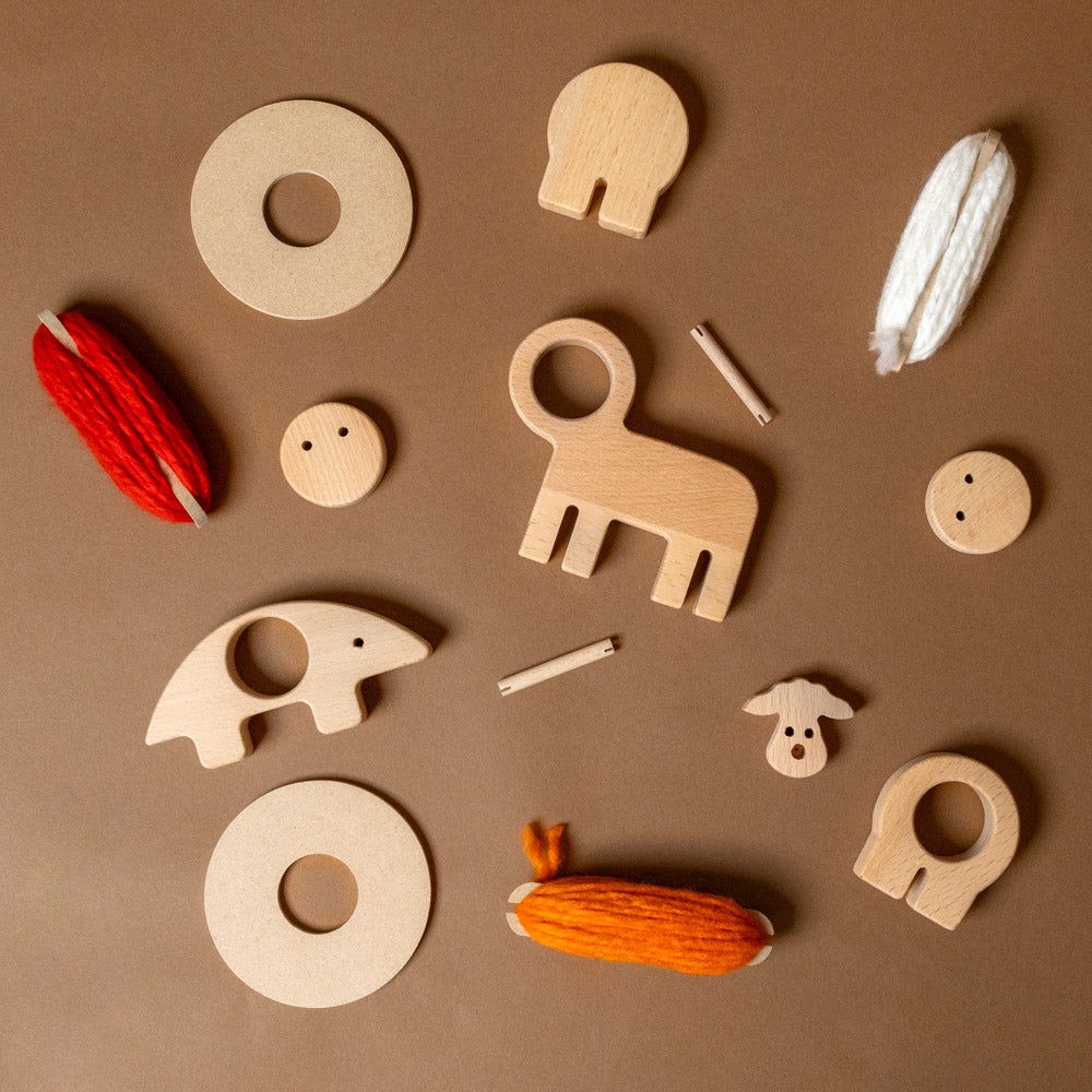 Collection of wooden toys on a brown background