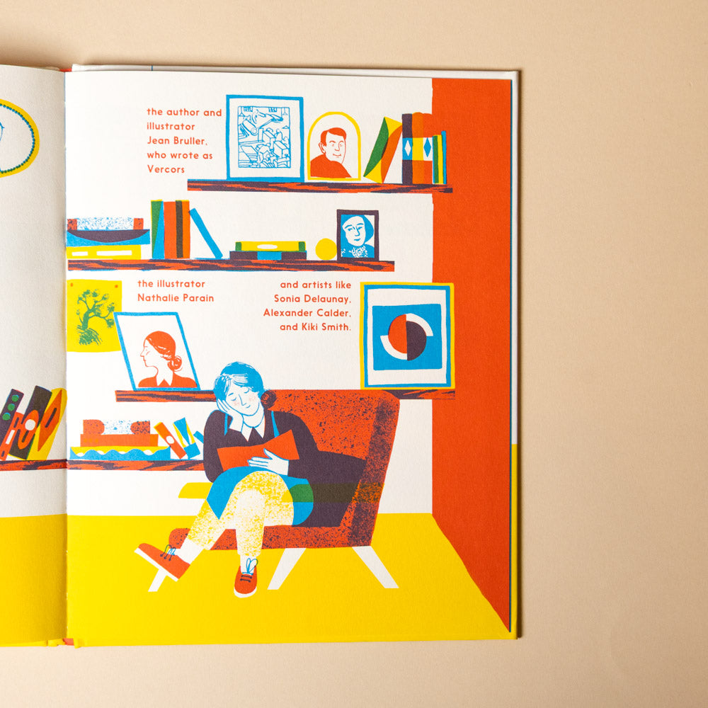 meet-the-lithographer open book page with a person sitting on a chair in a room with shelves and artwork.