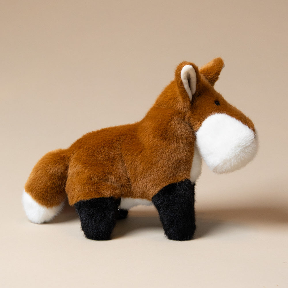 muzzle-frankie-fox-large Plush toy fox on a beige background