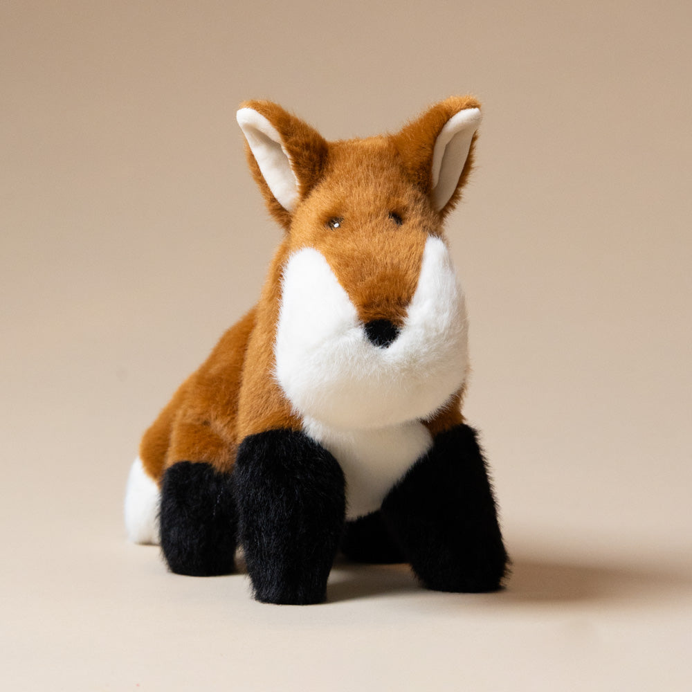 muzzle-frankie-fox-large Plush fox toy on a beige background