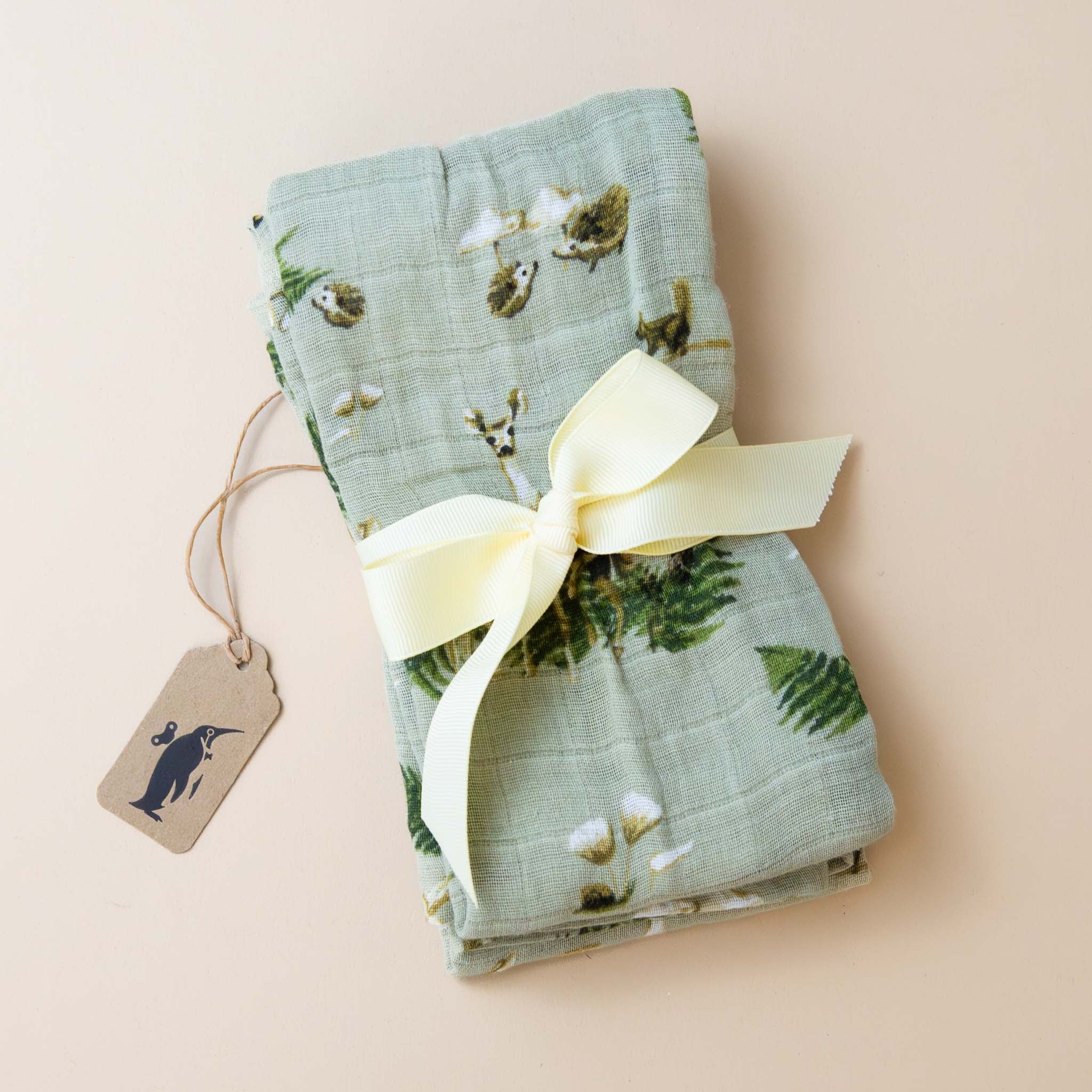 organic-cotton-burpie-set-forest-party-print-with-deer-and-forest-animals-on-sage-green-tied-with-ribbon