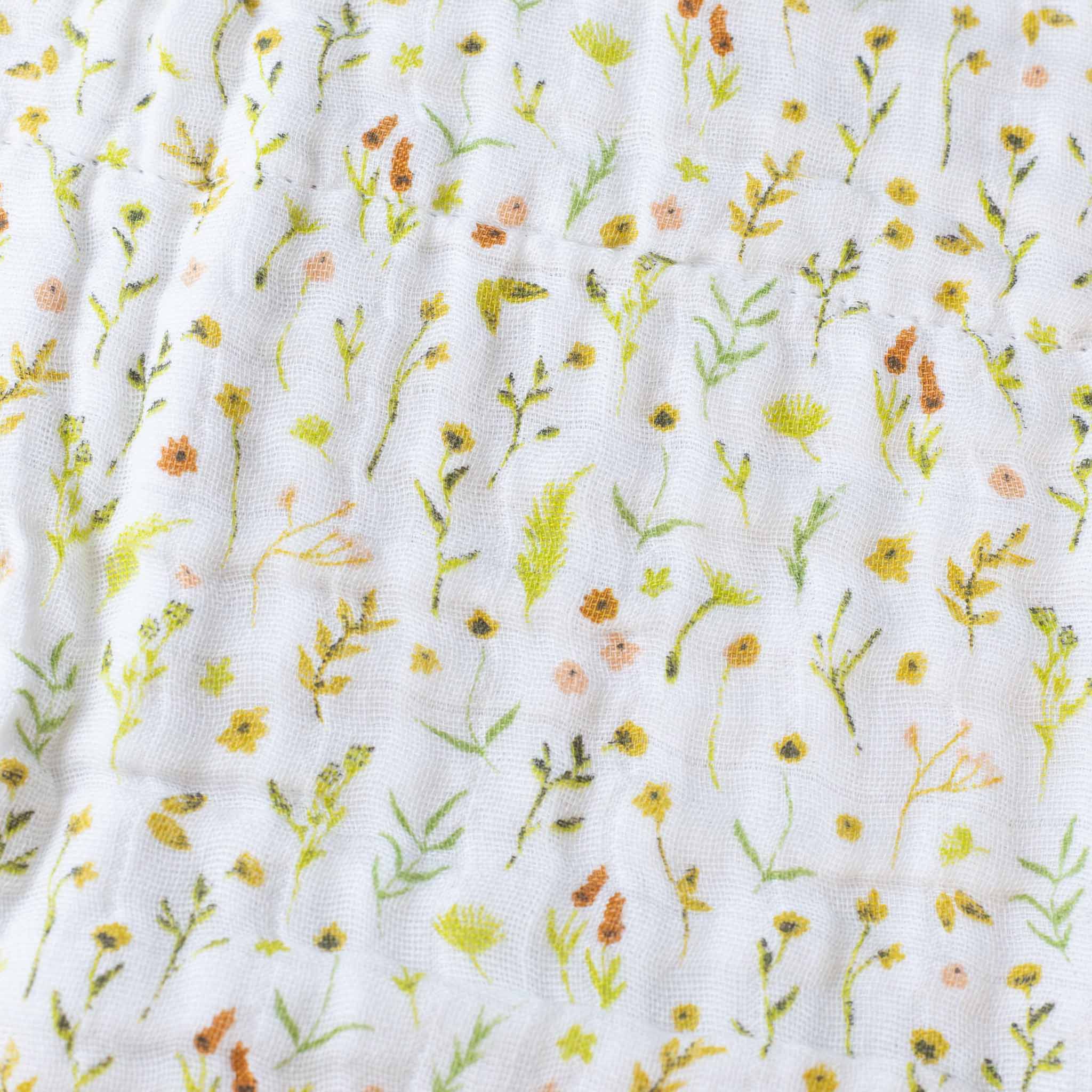 organic-cotton-muslin-blanket-floral-fields-driftwood-trip-green-orange-pattern