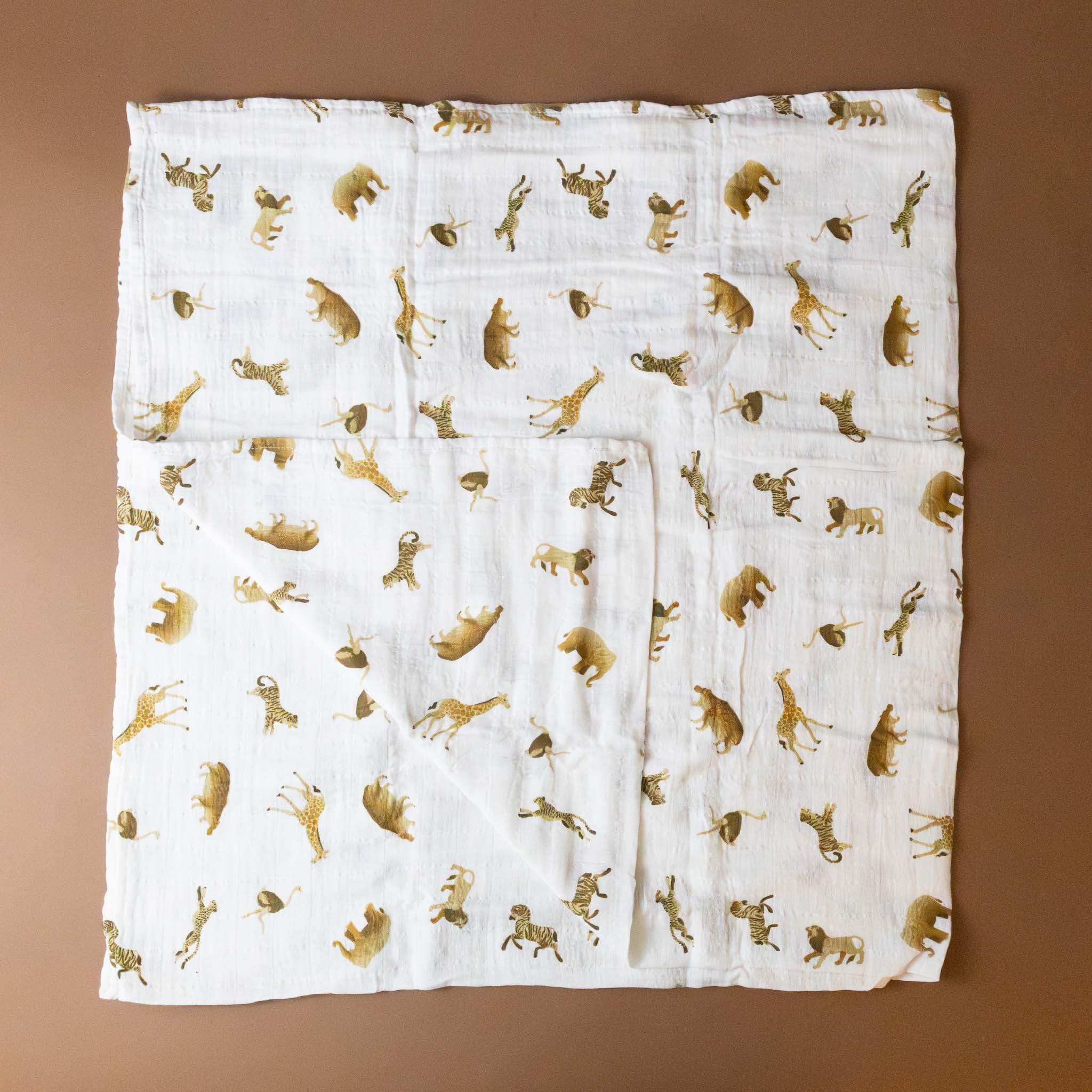 organic-cotton-muslin-swaddle-animal-cracker