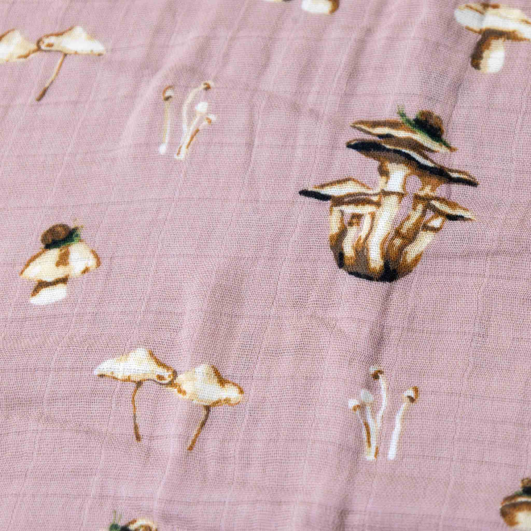 organic-cotton-swaddle-mushrooms-pink-background-with-mushrooms-detail