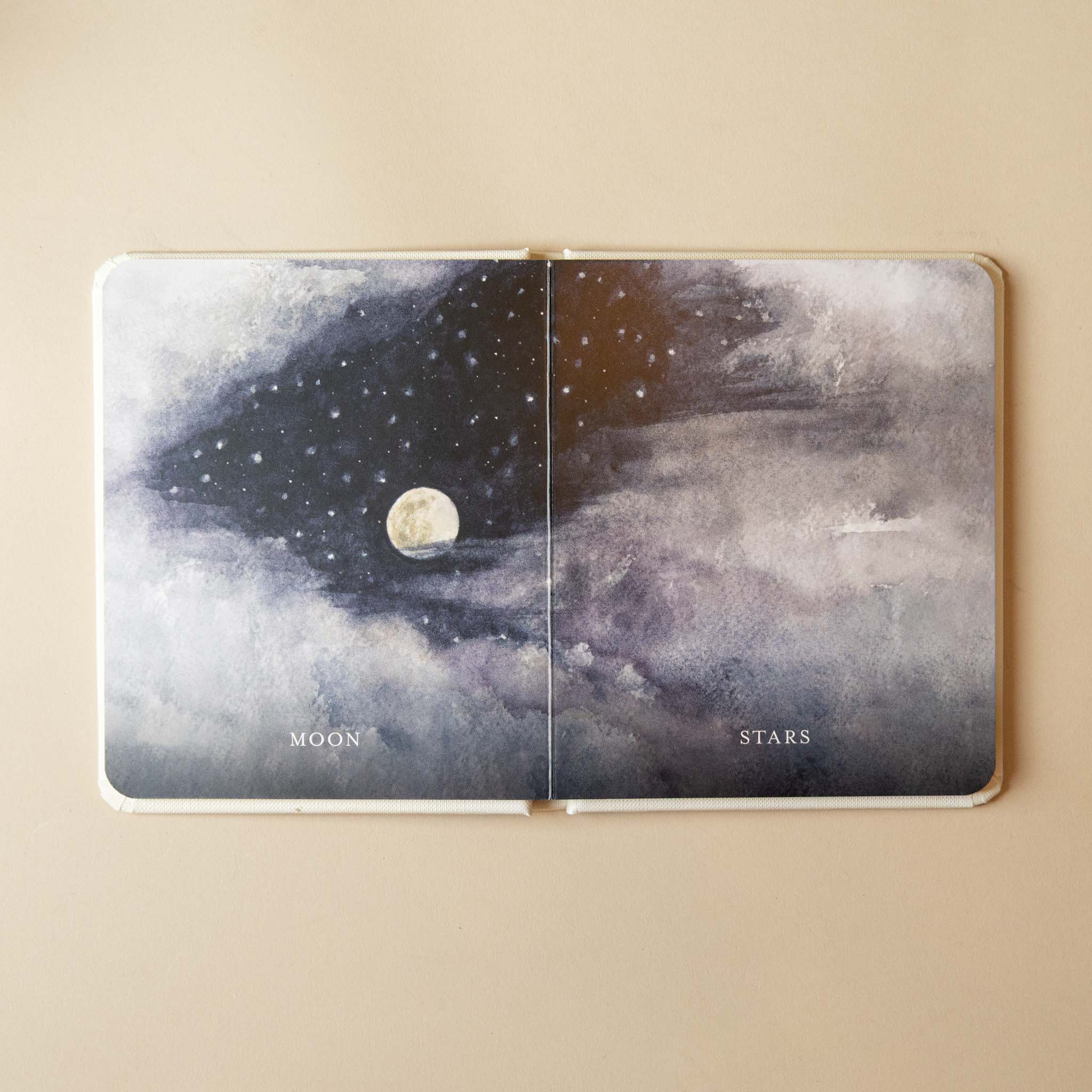 our-little-library-box-set--volume-iii-open-page-text-and- illustration- with 'Moon' and 'Stars' design on a beige background