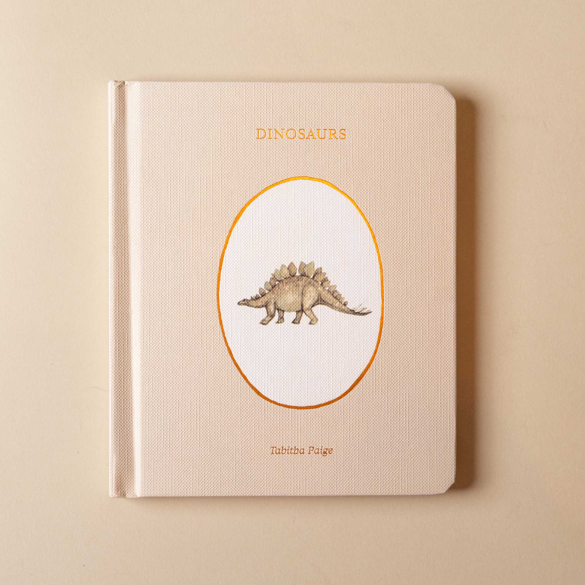 our-little-library-box-set--volume-iii-book-cover-text-and- illustration- dinosaur illustration on a beige background