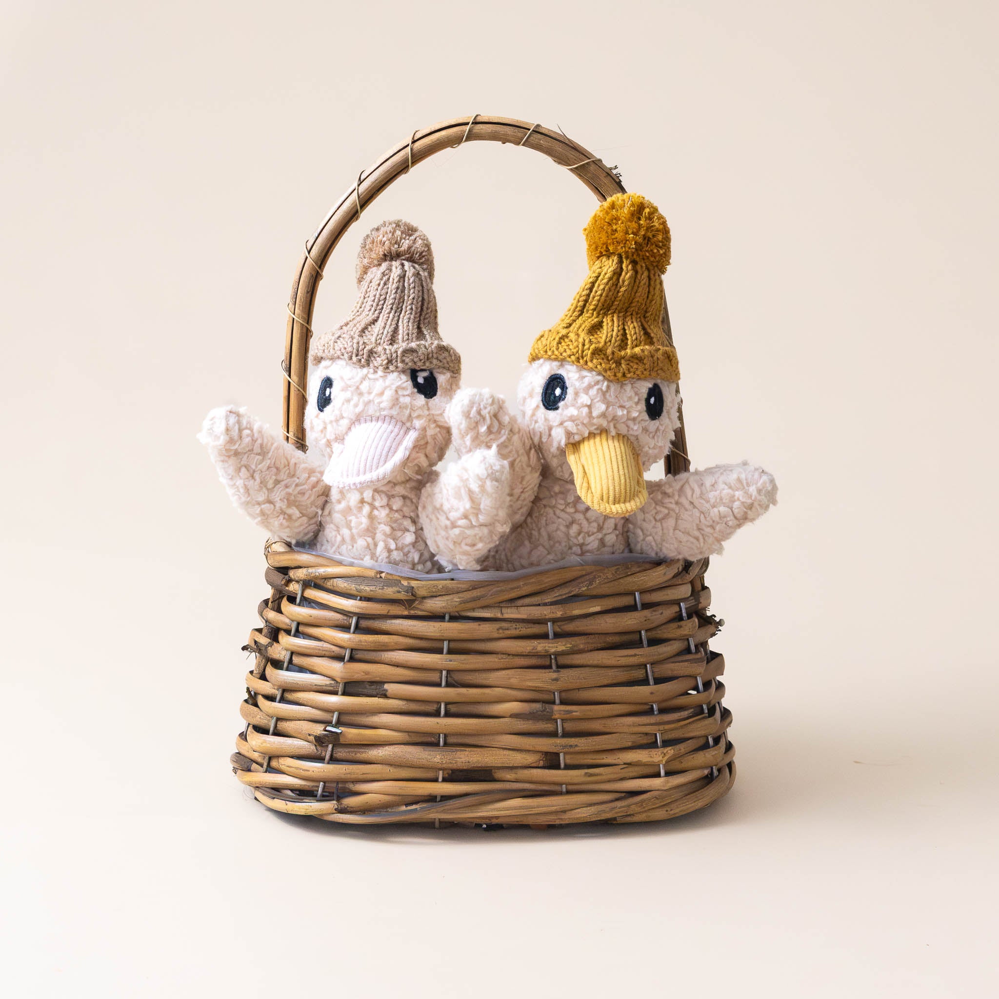 polished-woven-oval-basket-small-holding-two-stuffed-animals