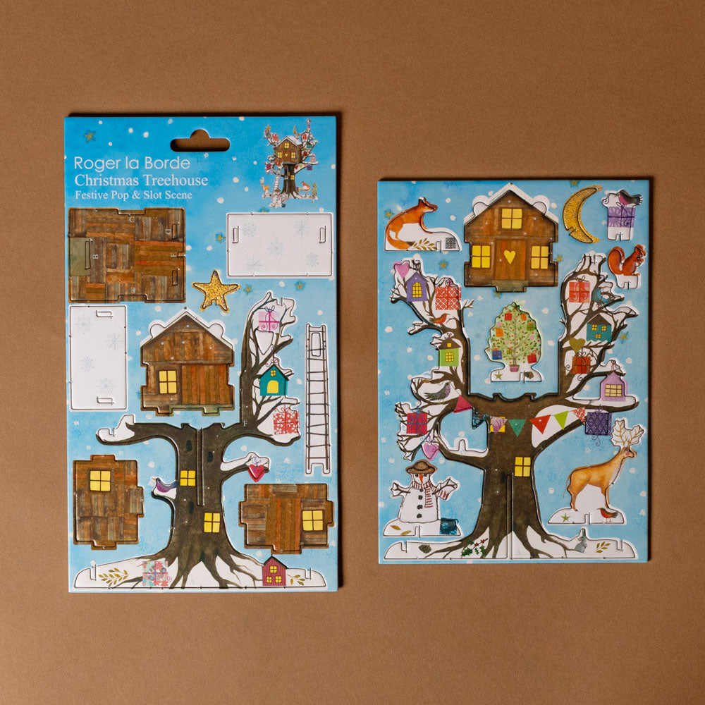 pop--slot-decoration--christmas-treehouse with a tree and houses on a brown background