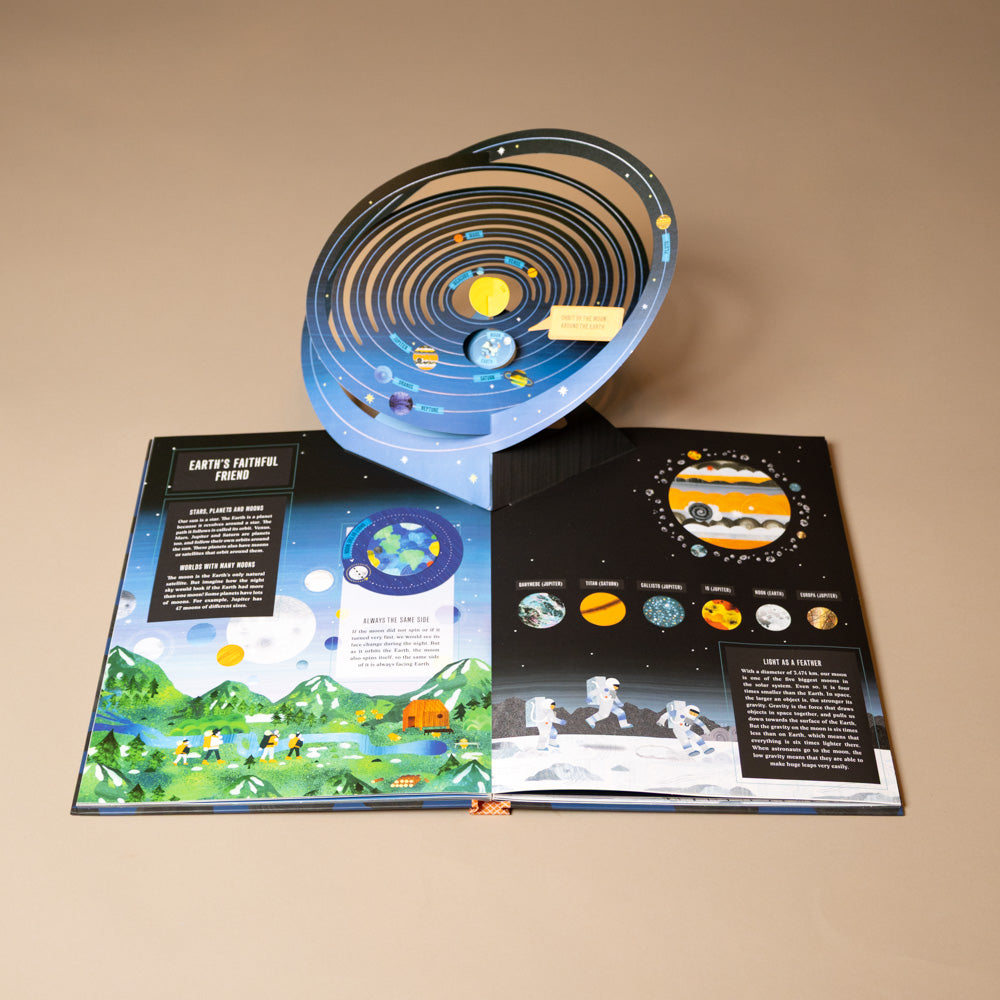 pop-up-moon-book Educational solar system model with illustrations on a beige background