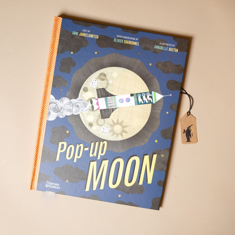 Pop-up book titled 'Pop-up Moon' on a beige background
