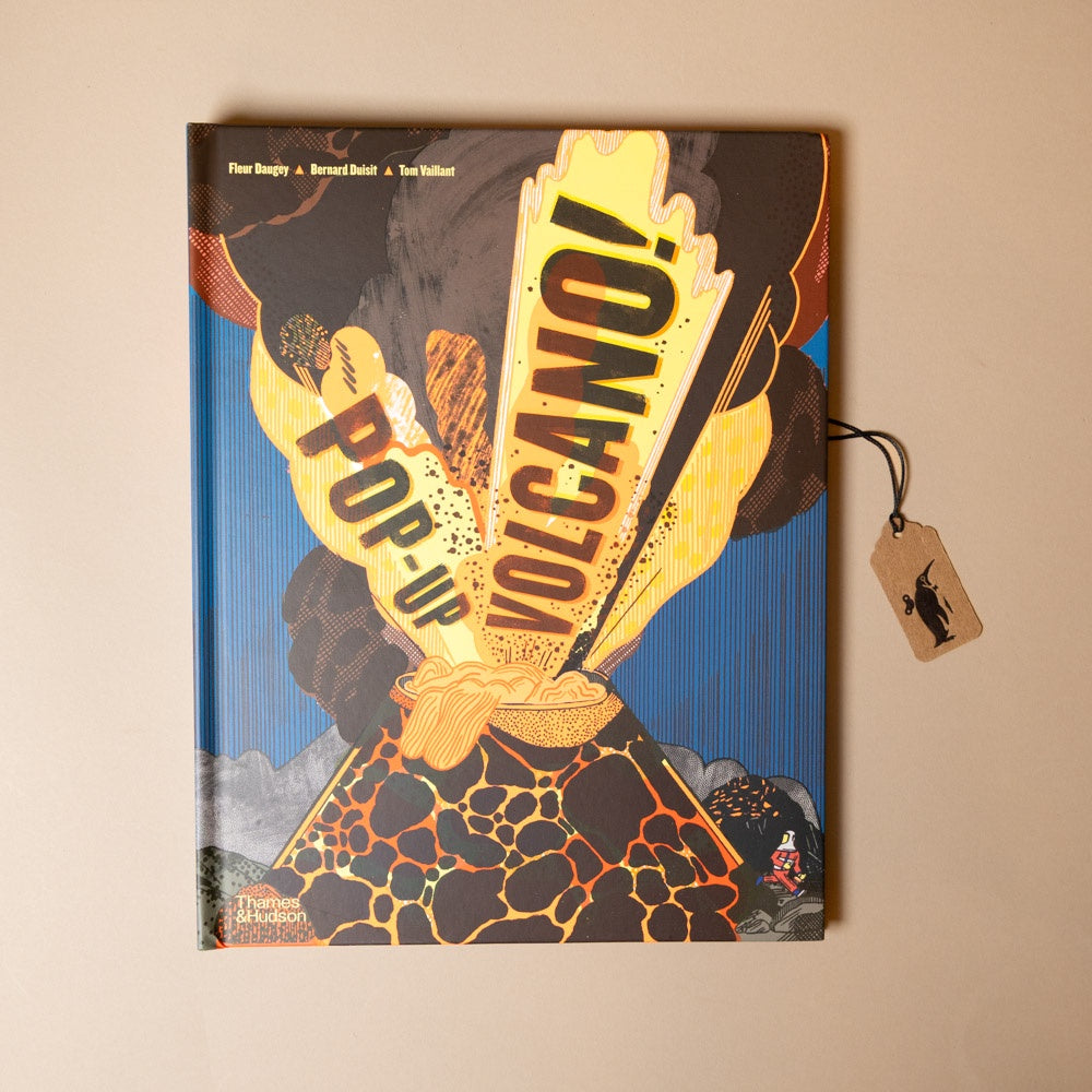 Pop-up book titled 'Pop-Up Volcano' with a tag on a beige background