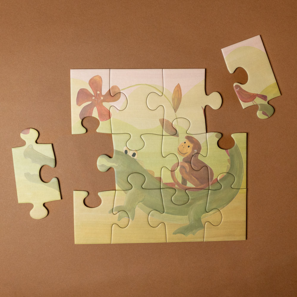 progressive-puzzle-set-african-savanna Children's puzzle with a monkey and flower design on a brown background