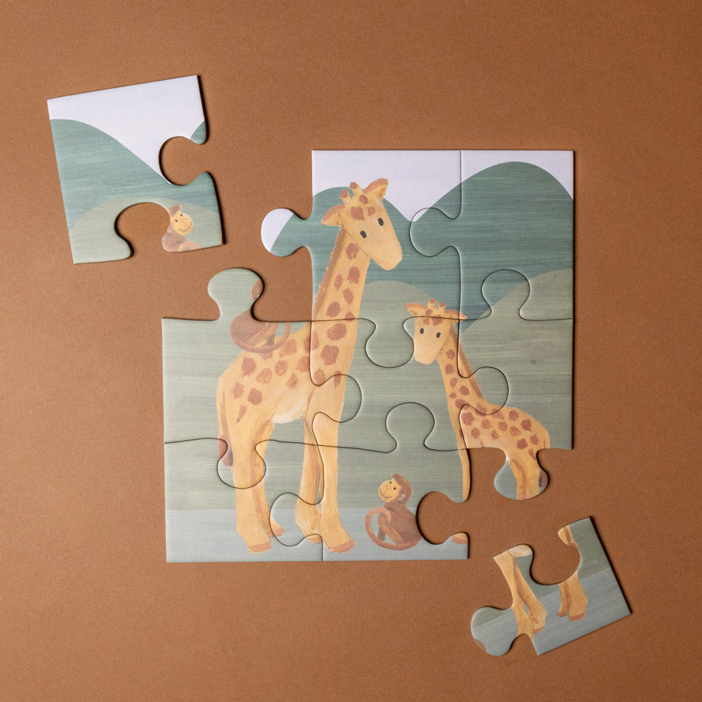 progressive-puzzle-set-african-savanna Children's puzzle with giraffe design on a brown background