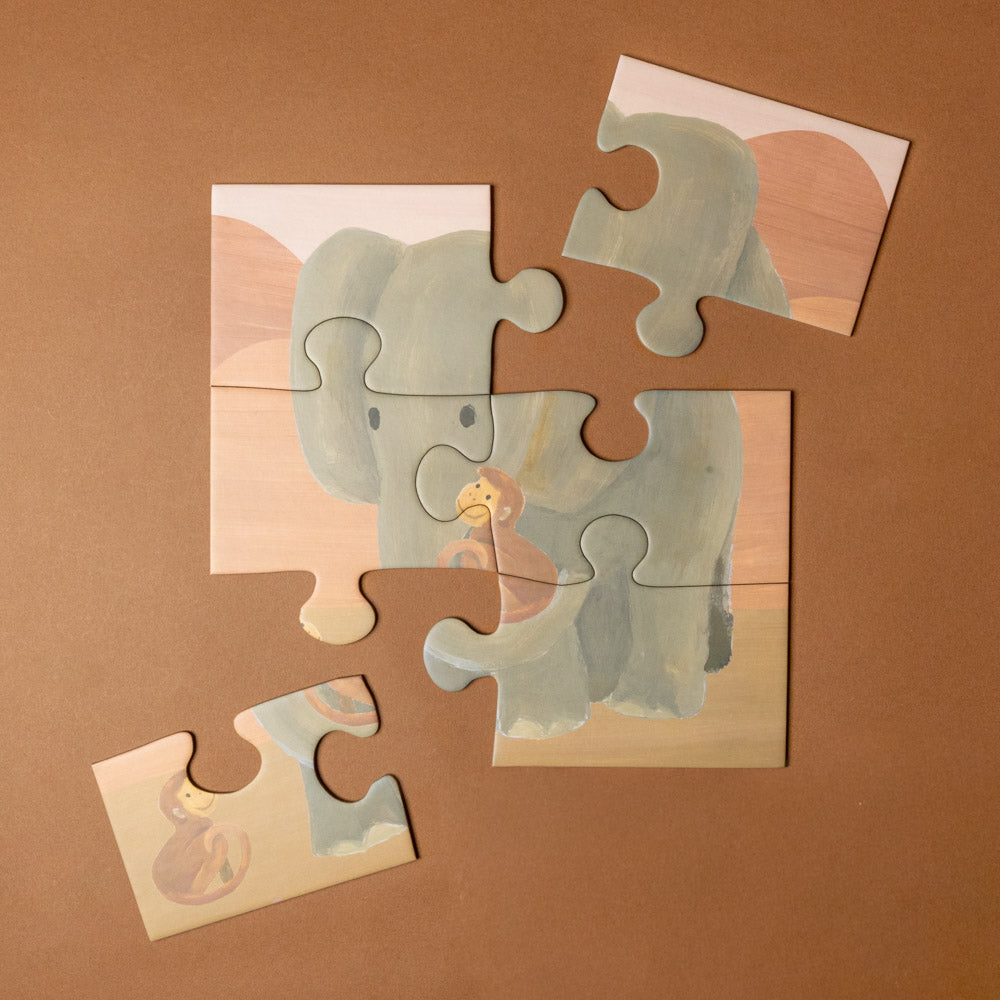 progressive-puzzle-set-african-savanna Jigsaw puzzle of an elephant and baby on a brown background