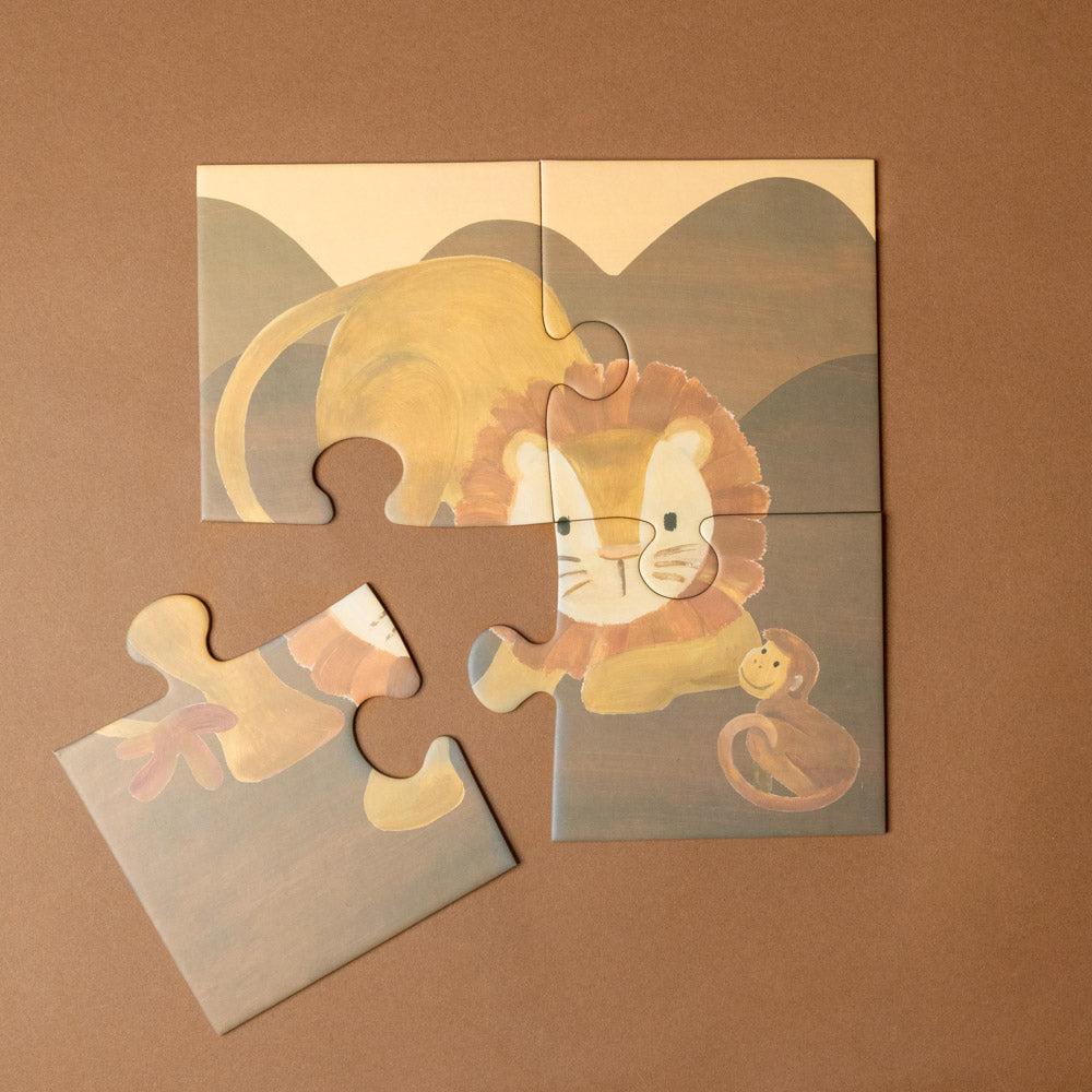 progressive-puzzle-set-african-savanna Children's puzzle with a lion design on a brown background