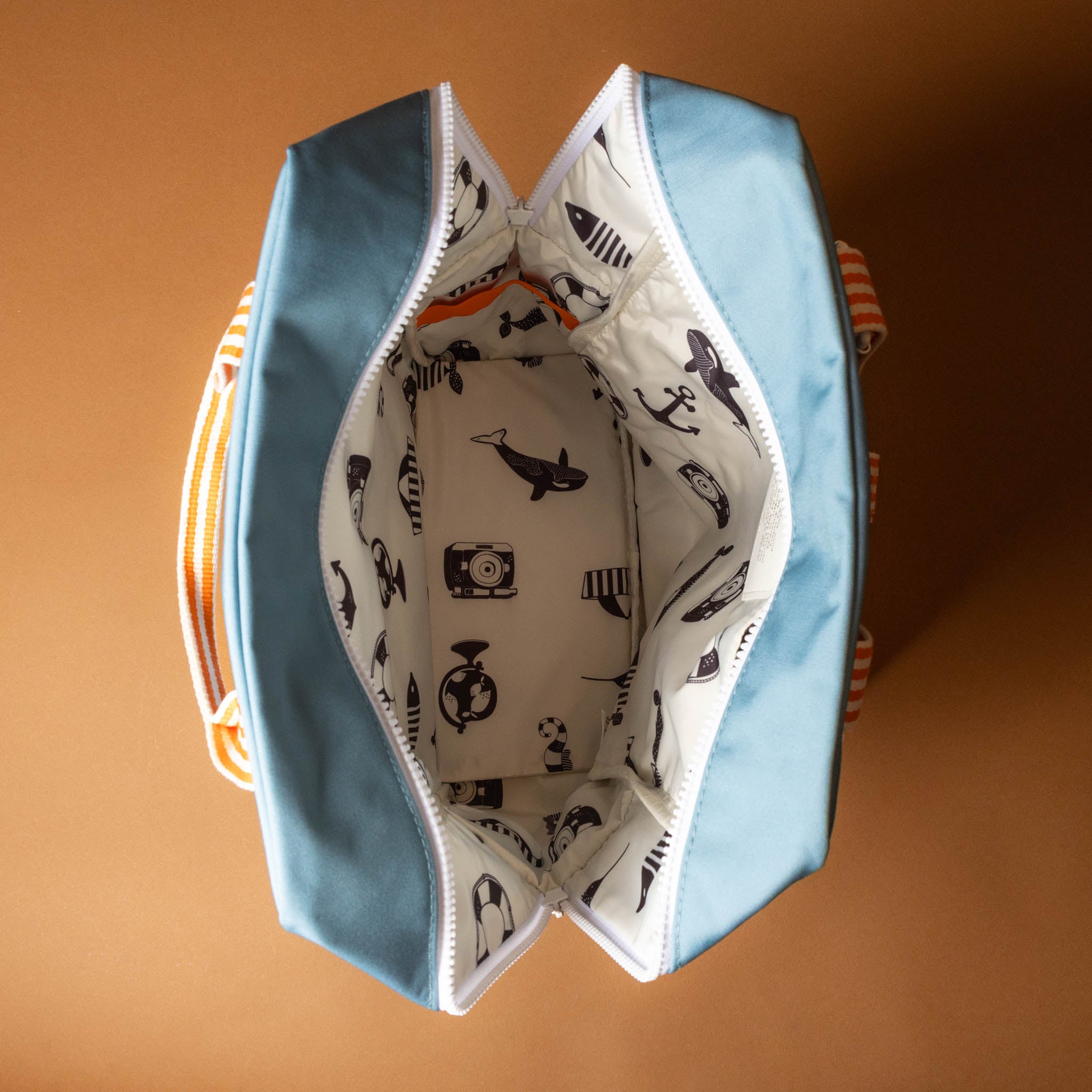 recycled-wonders-envelope-backpack-large-aquamarine-Blue-backpack-with-yellow -lightblue-accents-and-orange-striped-straps-inside